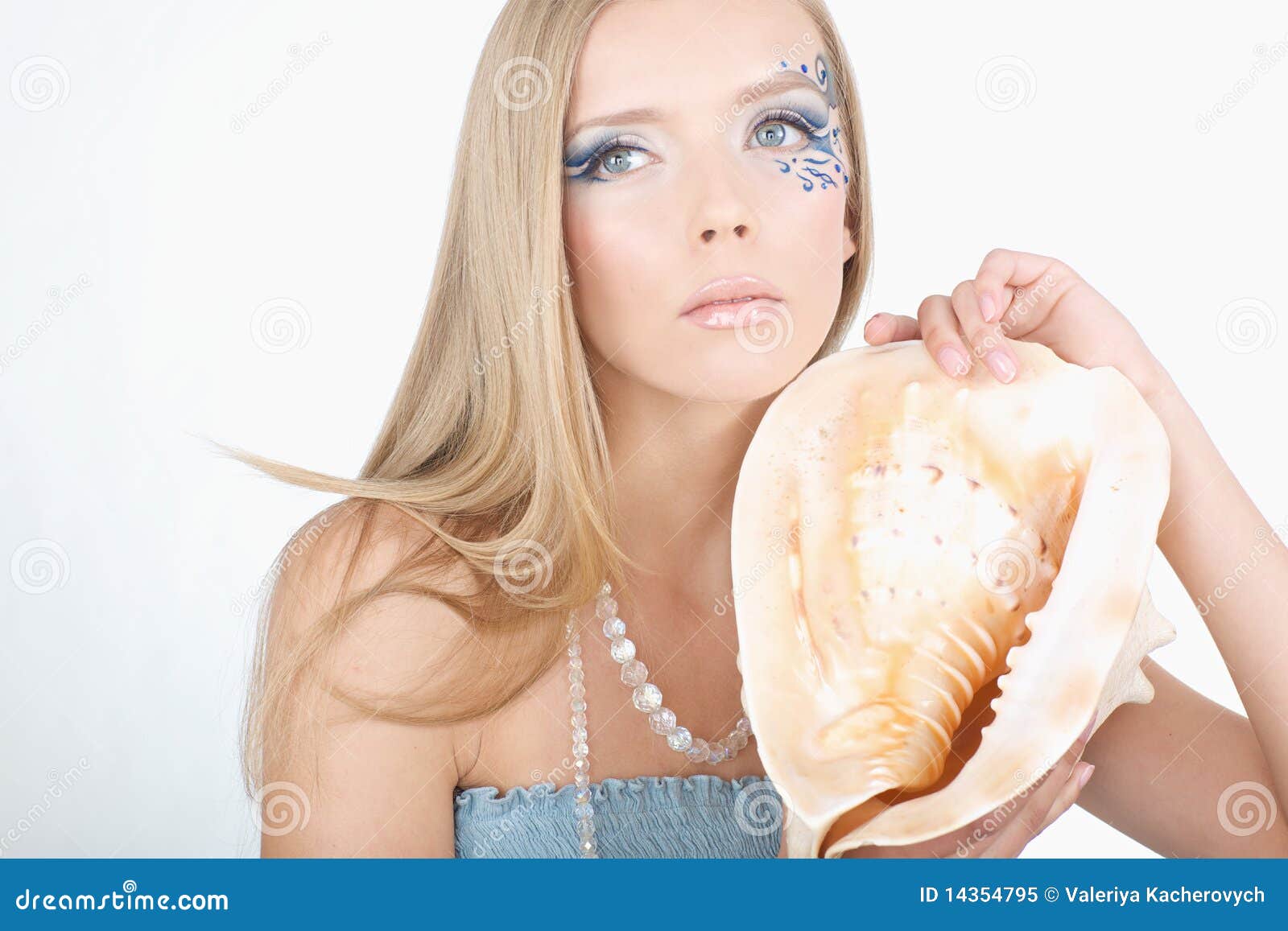 A Girl with a Seashell in His Hands, with a Sea of Stock Image Image