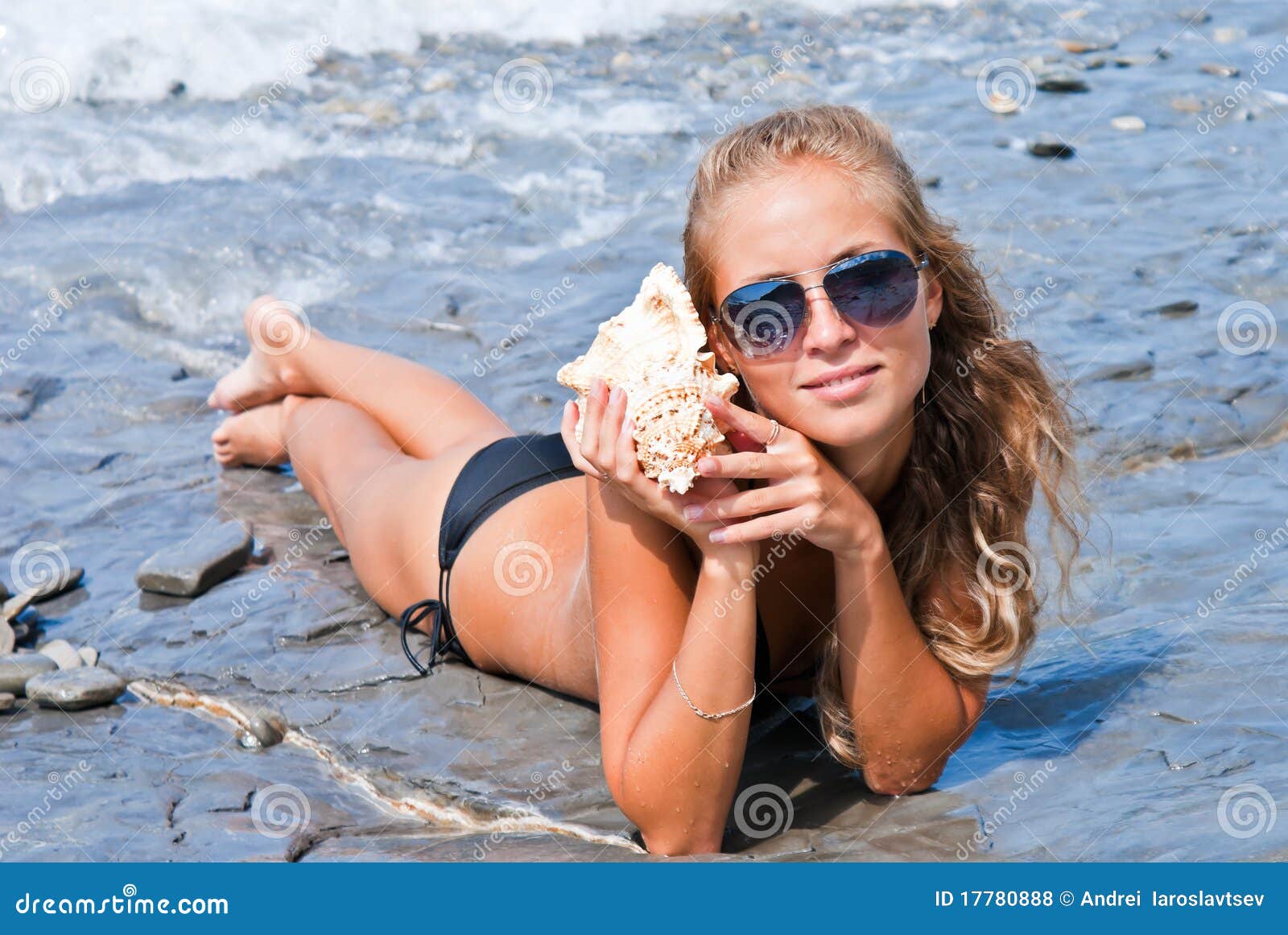 Girl with a Seashell on the Sea. Stock Photo Image of beauty, blue