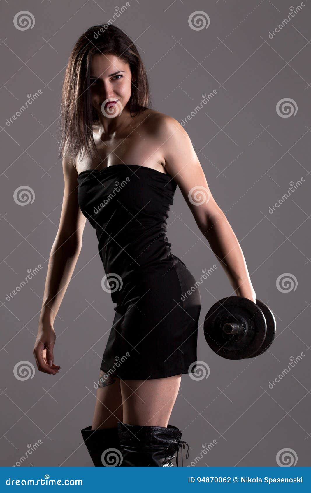 Girl in Black Dress Lifting Weights Stock Photo - Image of beautiful,  female: 94870062