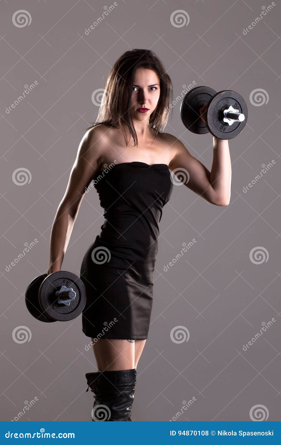 Girl in Black Dress Lifting Weights Stock Photo - Image of beautiful,  female: 94870062