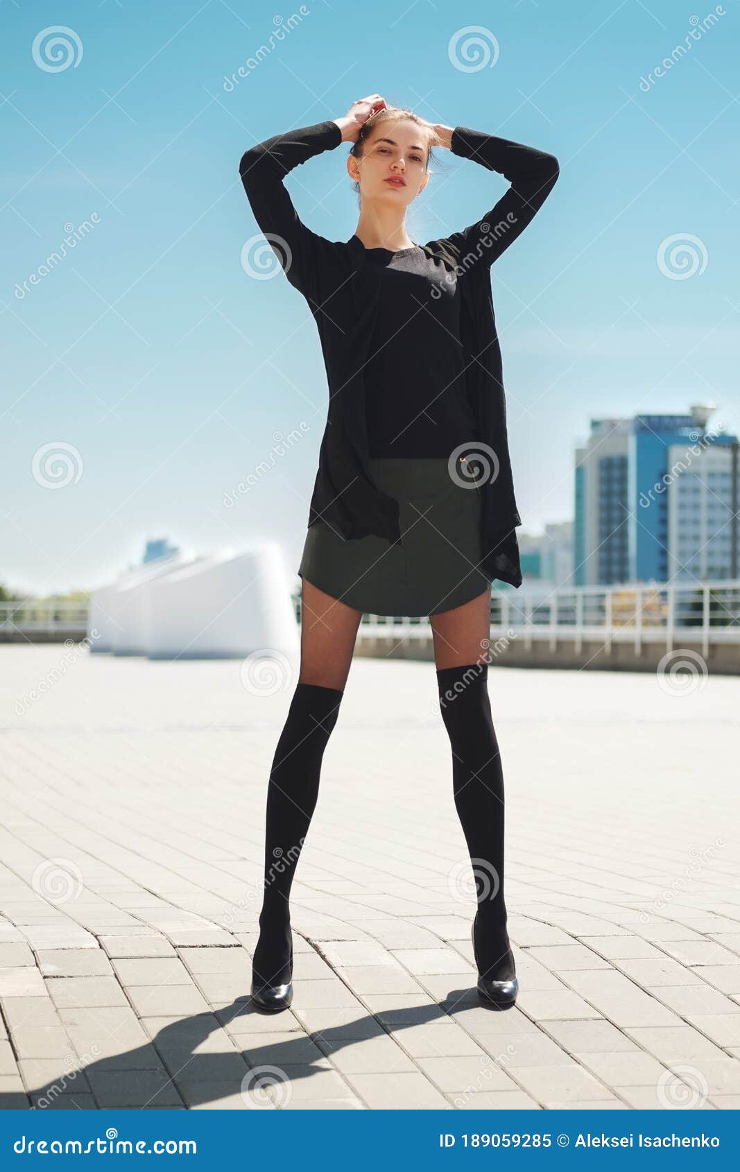 Girl in Short Leather Skirt and Legs with Knee Socks on Top of Tights  Enjoys the Sun with Hands Behind the Head Stock Image - Image of holiday,  enjoys: 189059285
