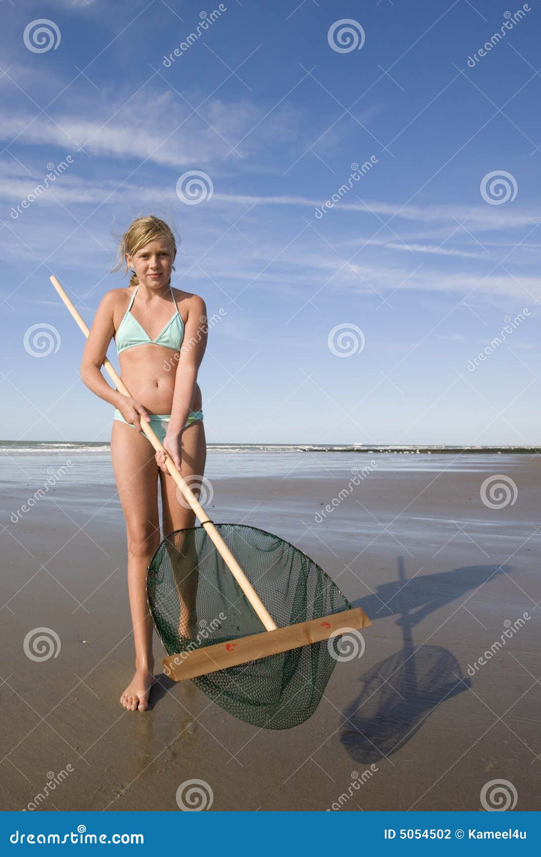 Girl Showing Her Fishing Net at the Beach Stock Photo - Image of