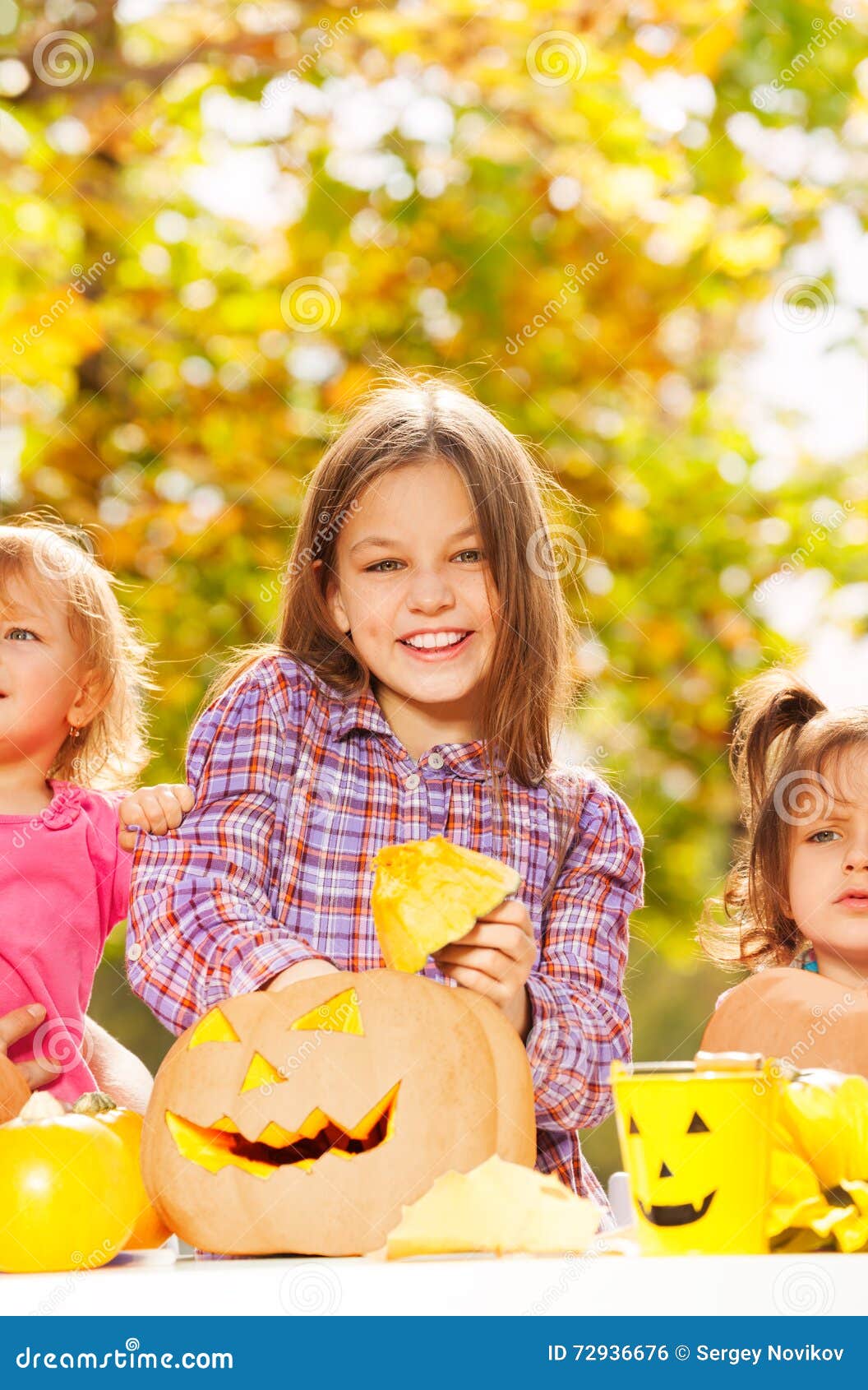 Girl with Sisters Carve Pumpkins for Halloween Stock Photo - Image of ...