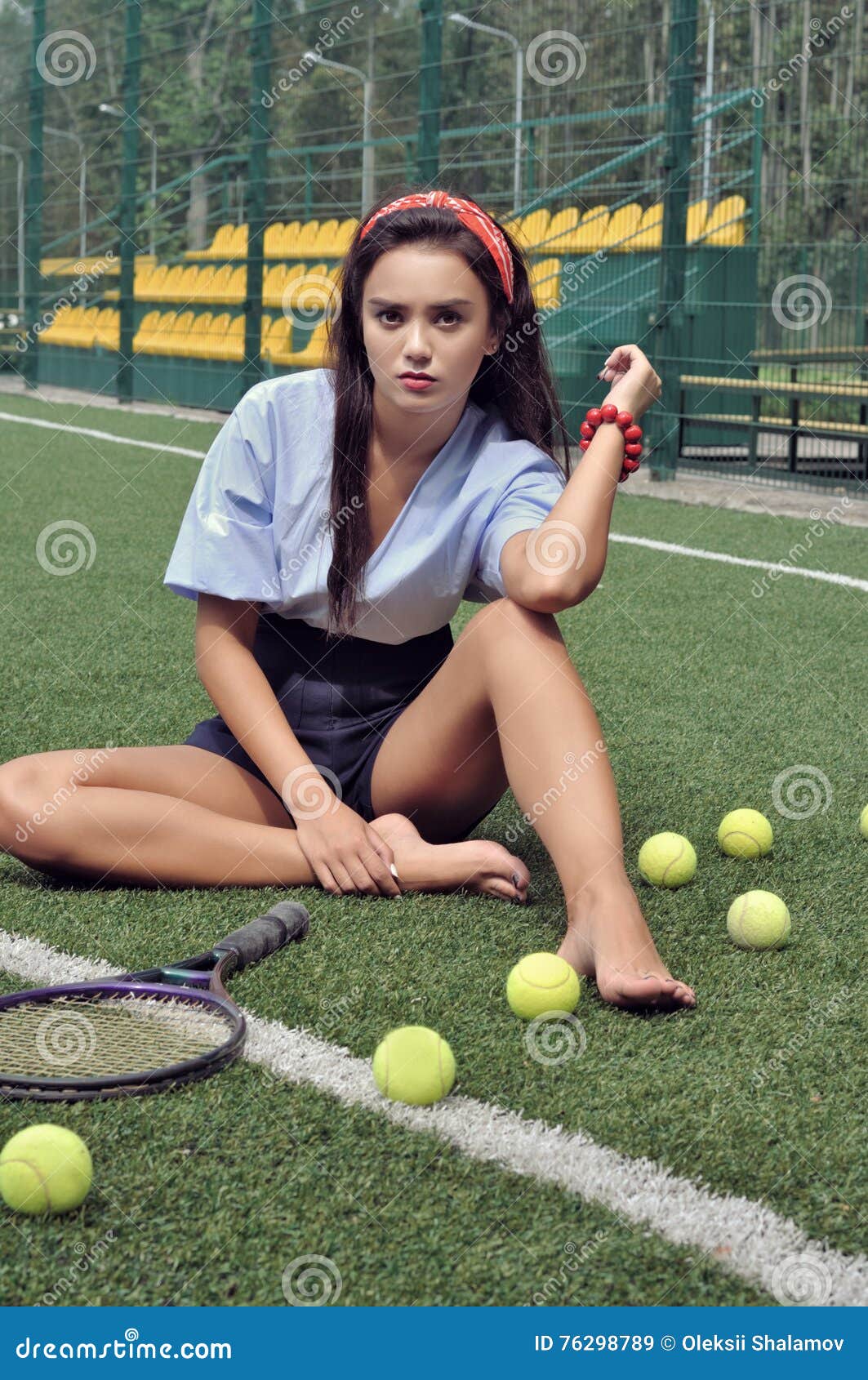 https://thumbs.dreamstime.com/z/girl-sits-cour-court-next-to-her-lies-racket-balls-wearing-blue-shirt-dark-blue-shorts-high-heeled-76298789.jpg