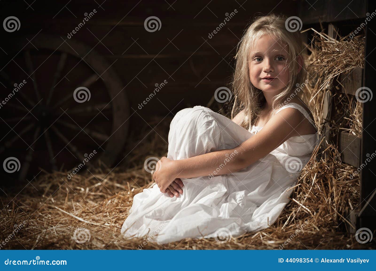 Girl Sits On Hay In The Barn Stock Photo - Image of lying 