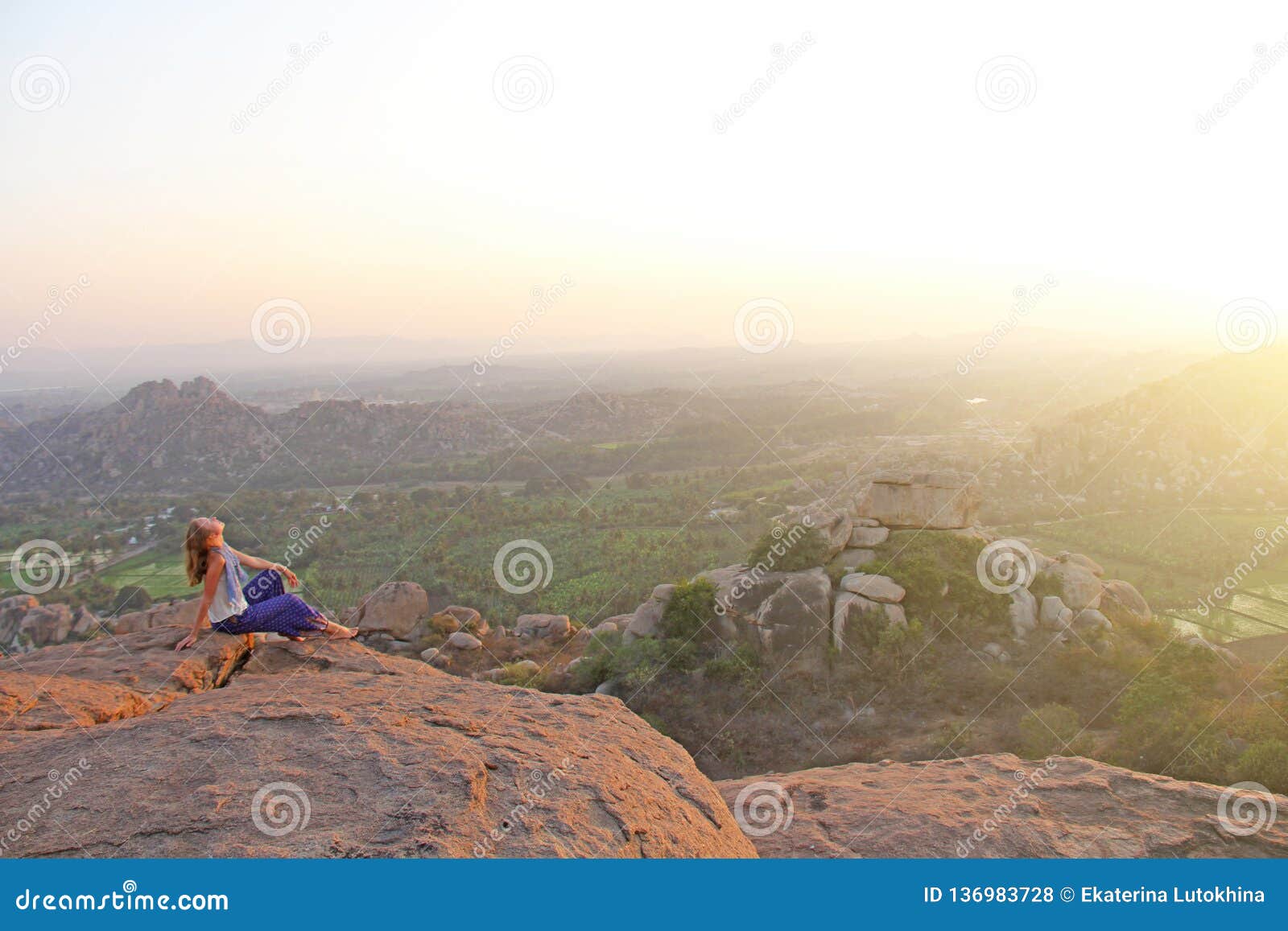 Young Girl Meditating With Yoga On A Mountain Cliff Stock 