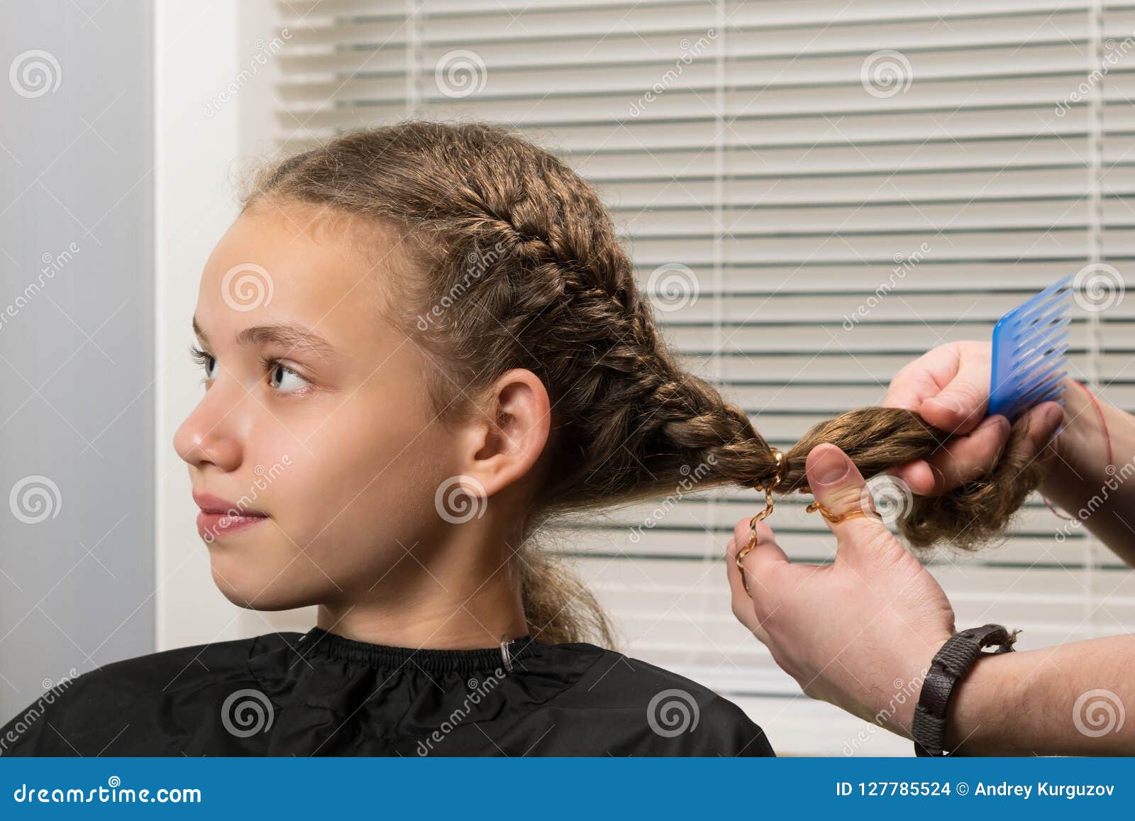 the girl sits at the master on hairdresses, does a stacking