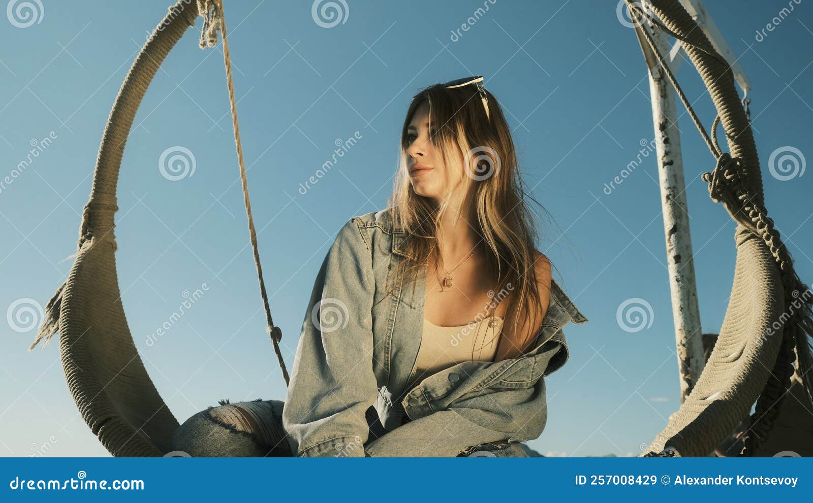Girl Sits on a Swing and Looks Away Stock Image - Image of girl, summer ...