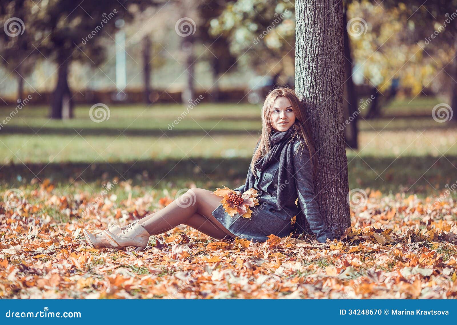 Girl Sitting with Autumn Bouquet in the Park Stock Photo - Image of ...