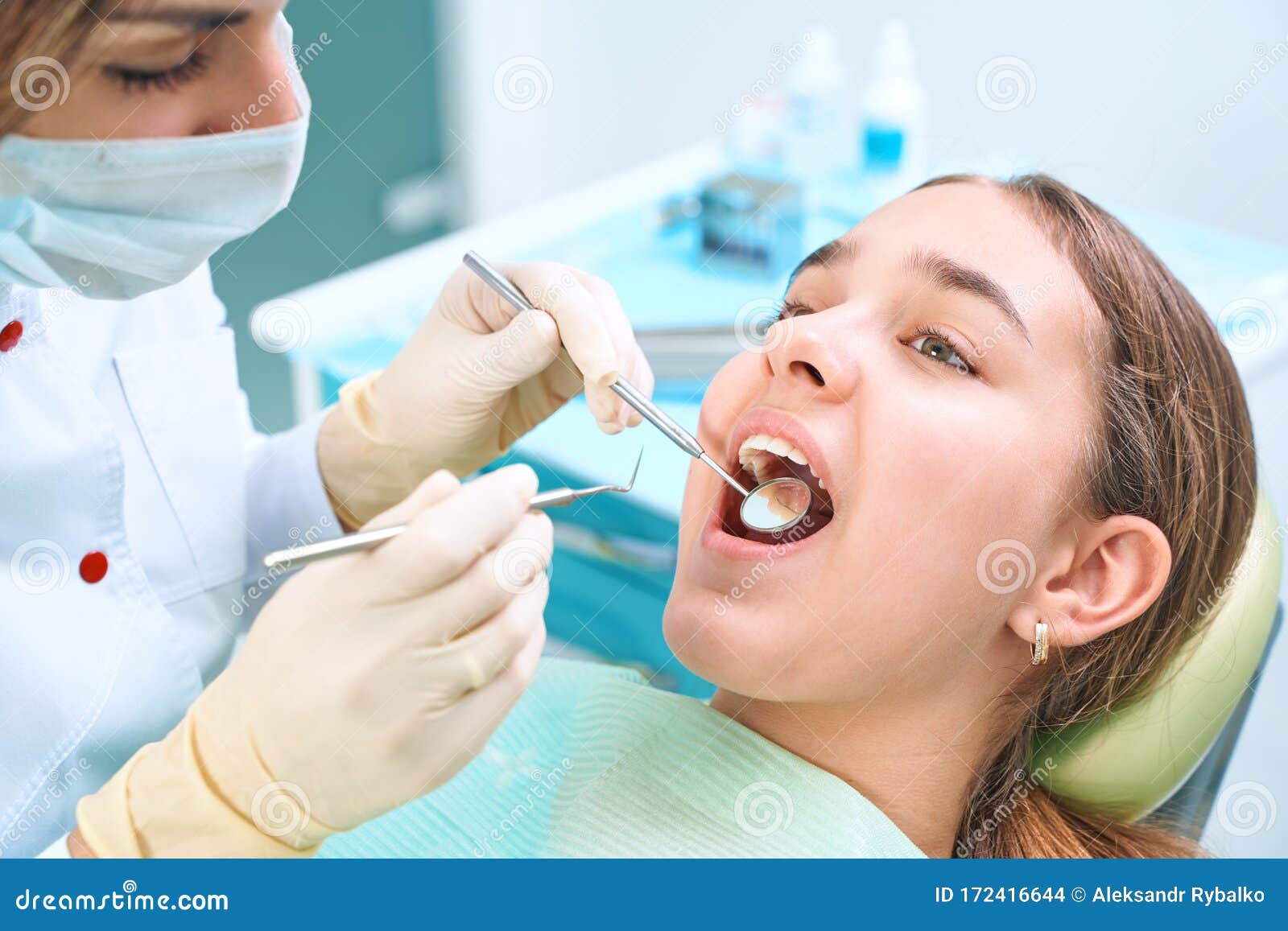 Girl Sitting at Dental Chair with Open Mouth during Oral Check Up while  Doctor. Visiting Dentist Office Stock Photo - Image of dentist, closeup:  172416644