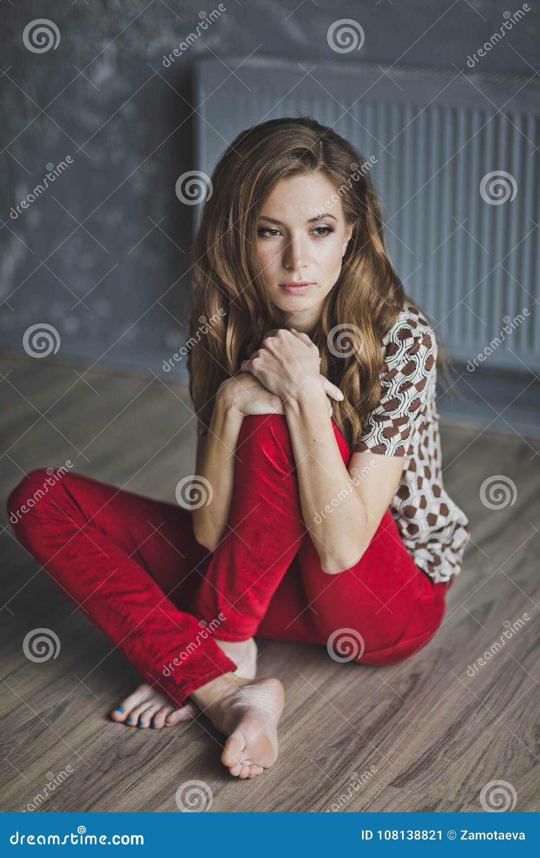 The Girl Sitting On The Floor Hugging His Knees 6954 Stock Image Image Of Cute Knees 108138821