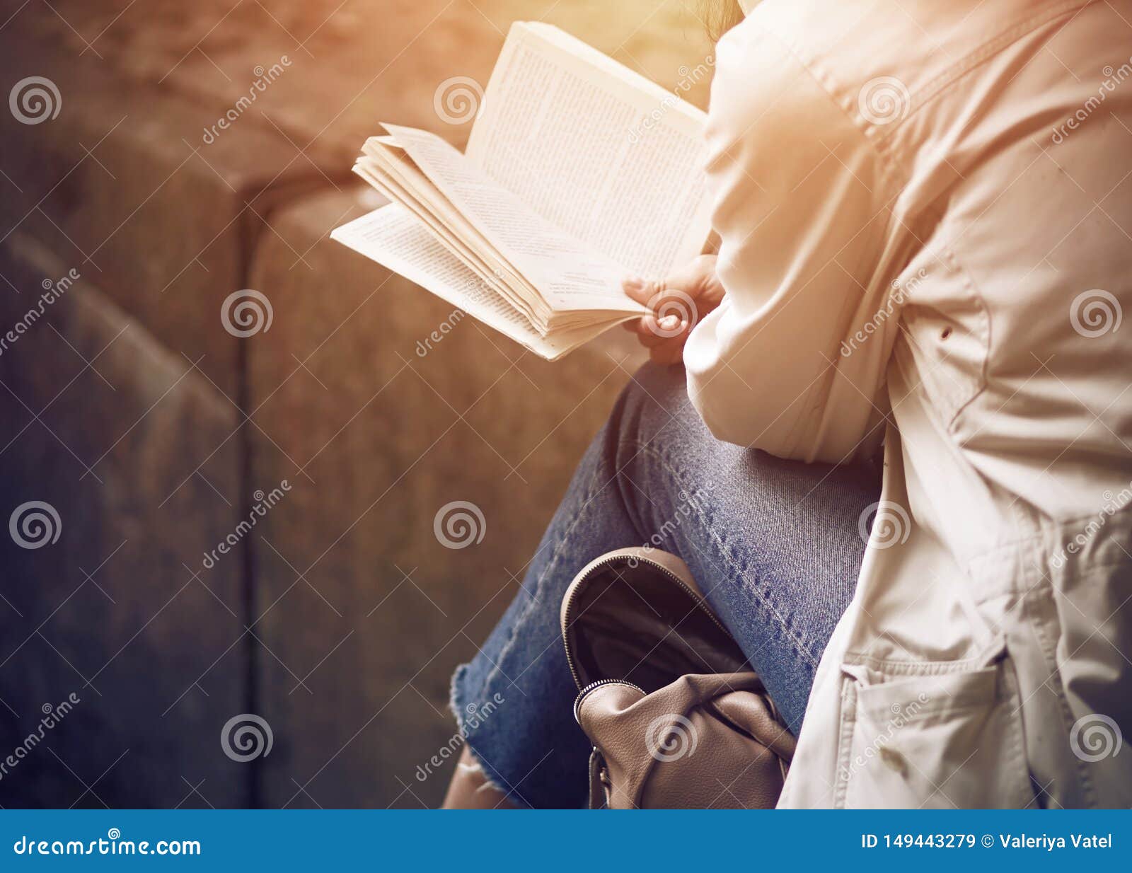 a girl sitting reading classical literature