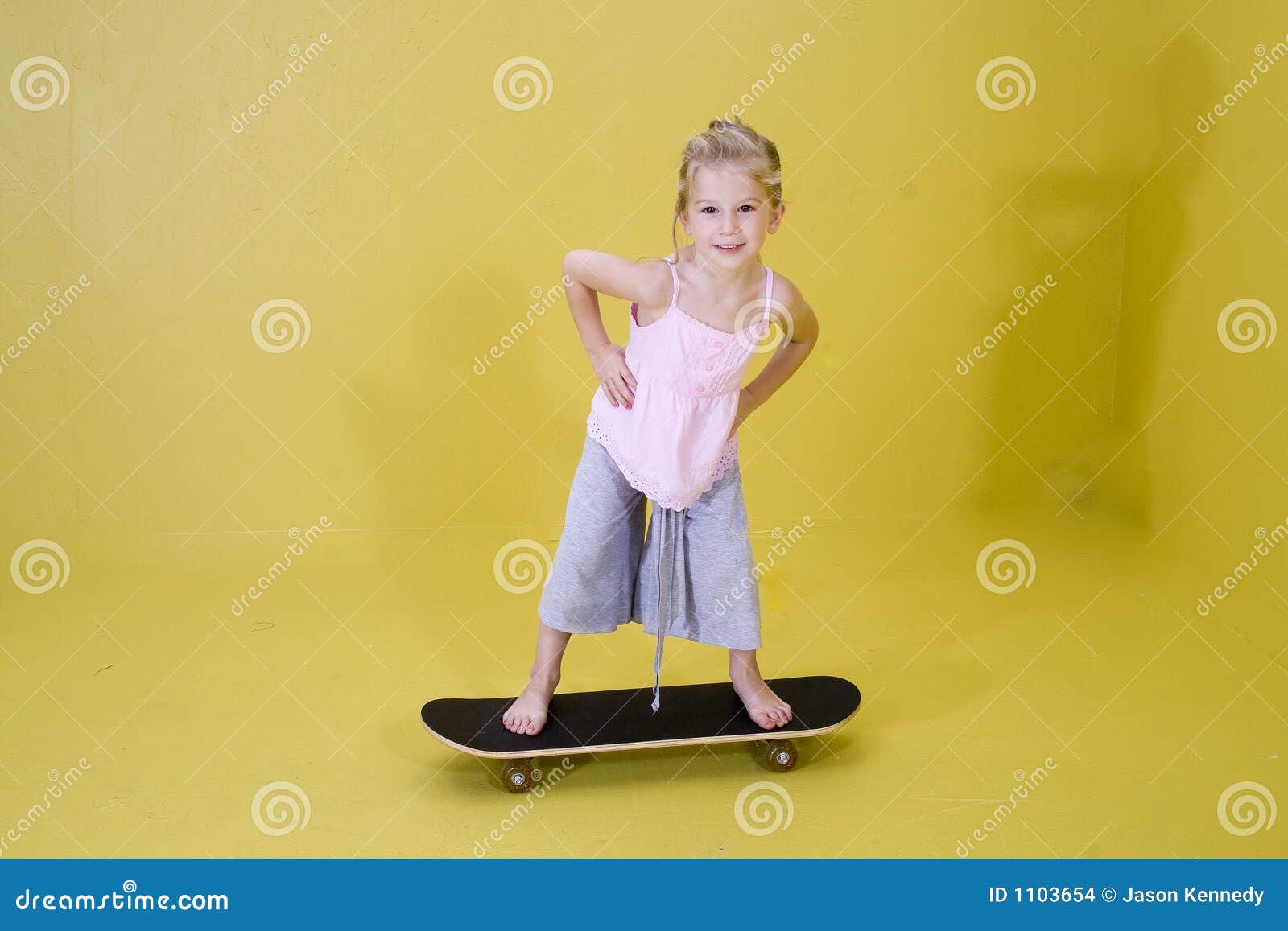 Girl on Skateboard stock photo. Image of blonde, cute 1103654