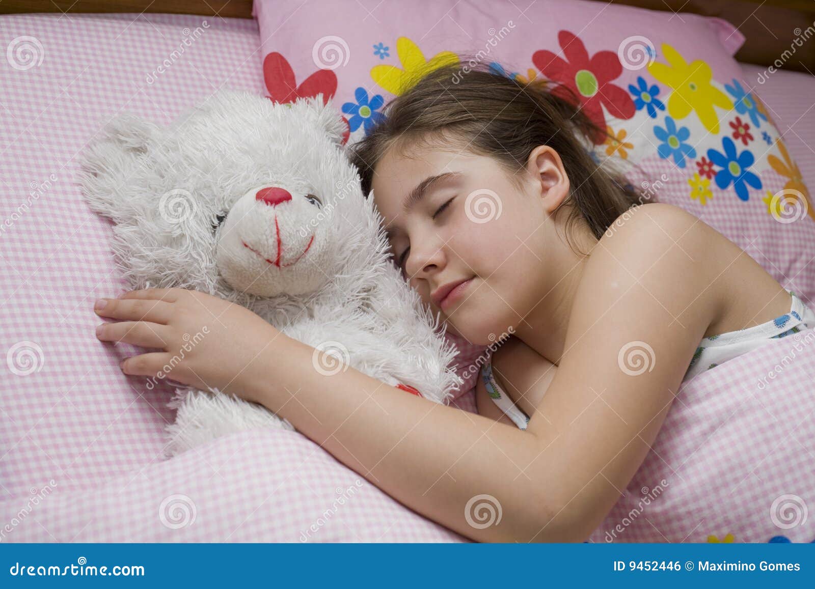 girl sleeping with teddy bear