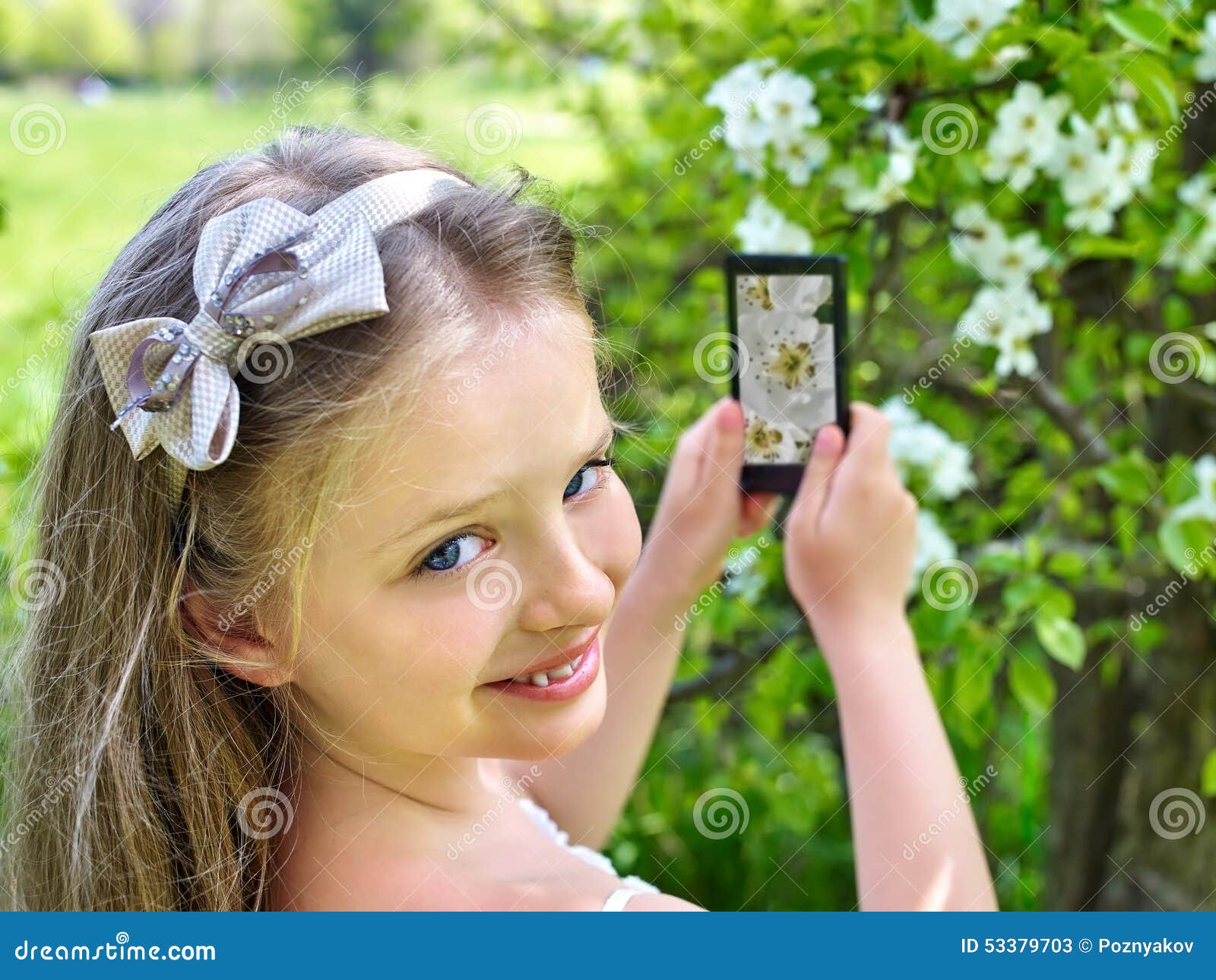 girl snapshot blossoming tree