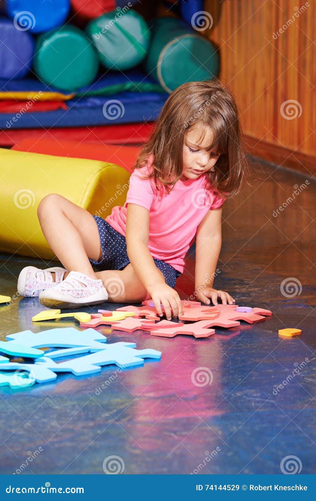 Girl Solving Jigsaw Puzzle in Kindergarten Stock Image Image of preschool, cute 74144529
