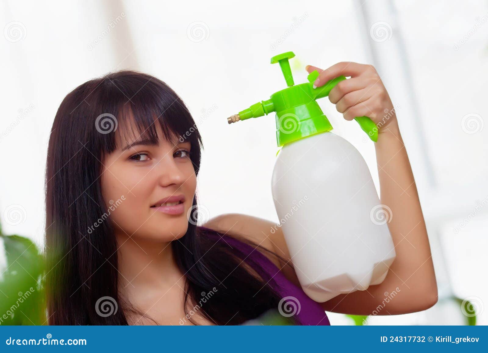 Girl with sprayer in hand stock photo. Image of care 24317732