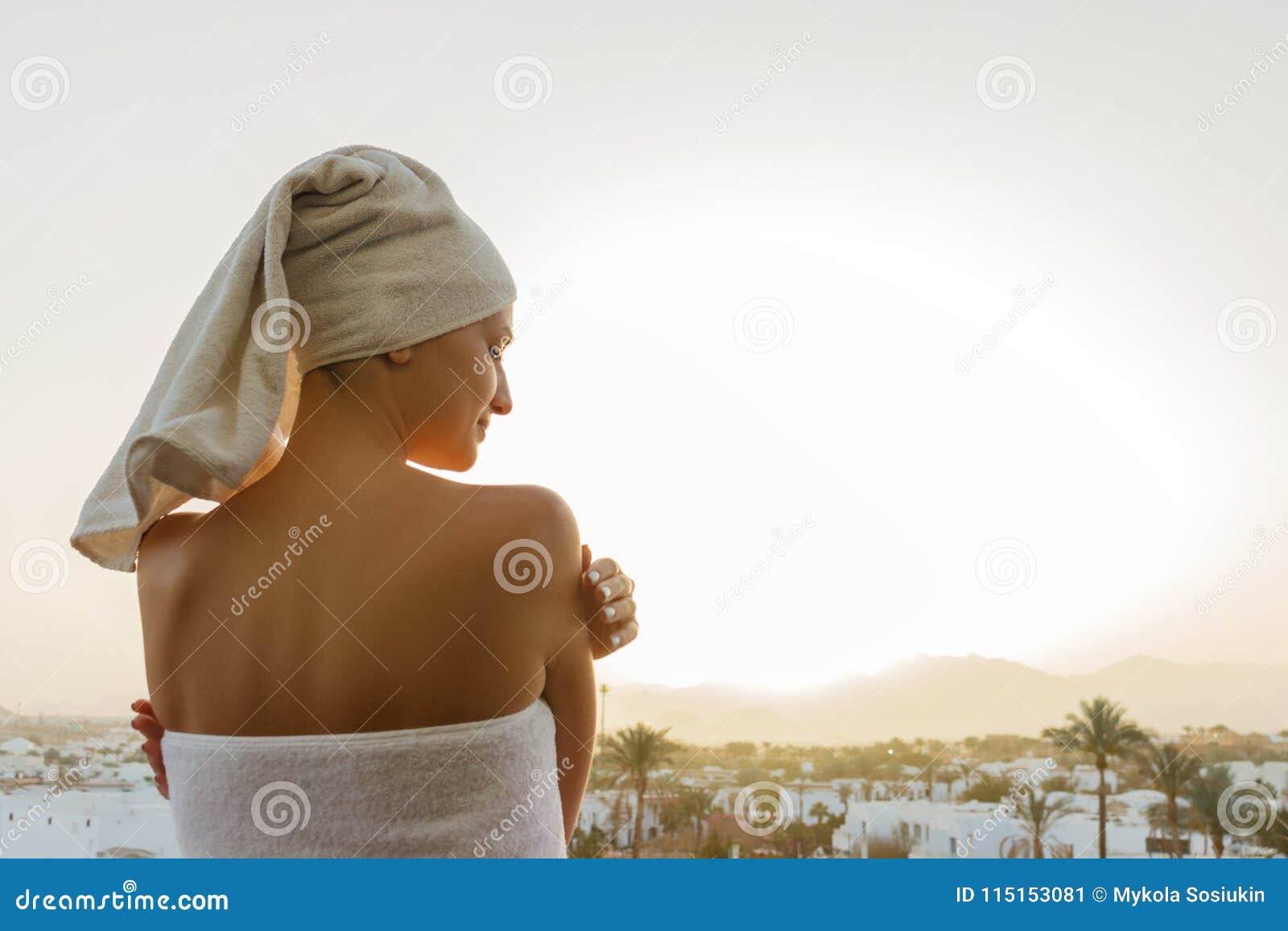 The Girl is Standing on the Balcony and Looking at the Sunset in the ...