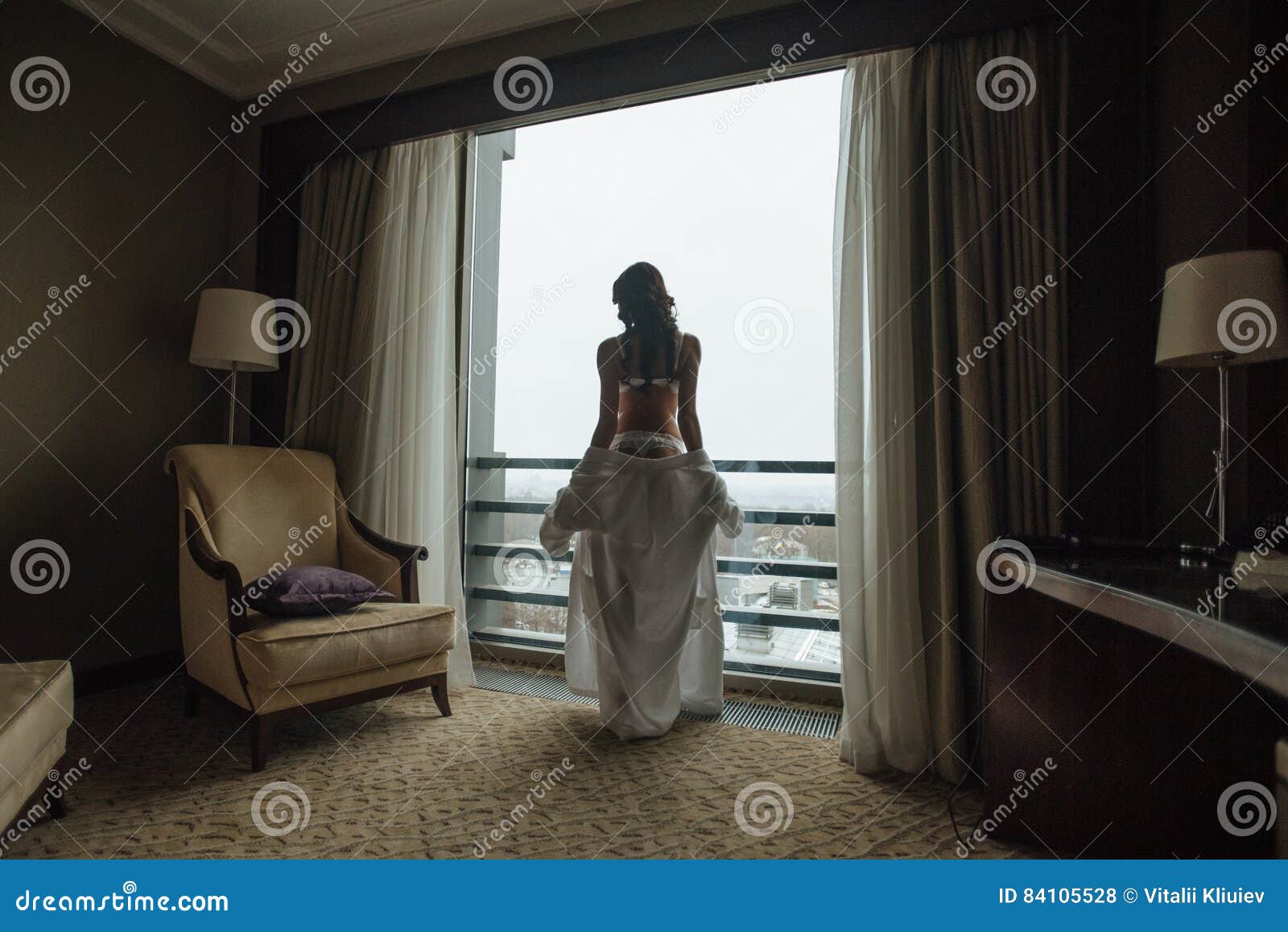 Girl Standing on the Bedroom in a Beautiful Position Stock Photo image