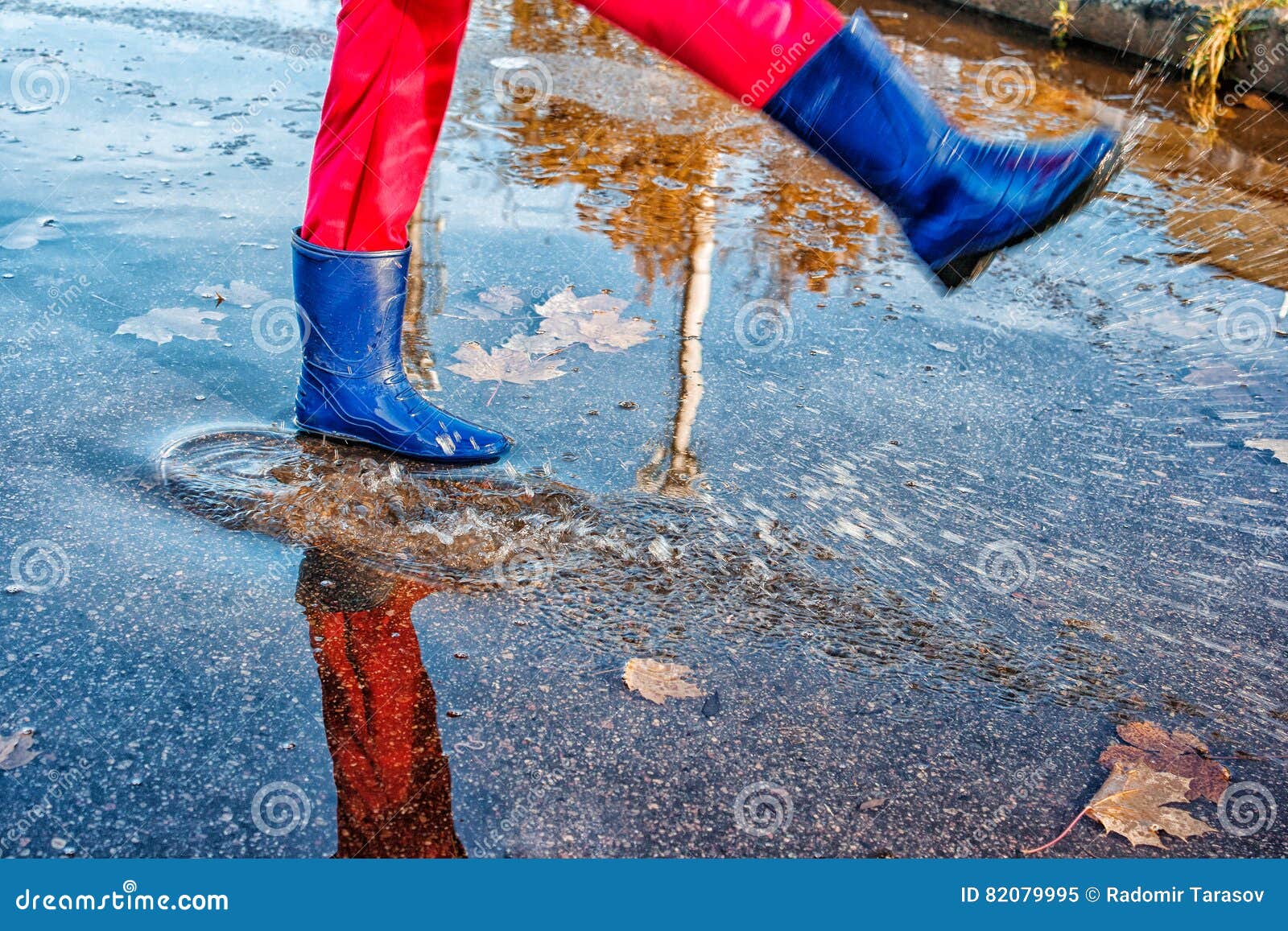 Girl Standing in a Puddle of Water Splashes Stock Image - Image of girl ...