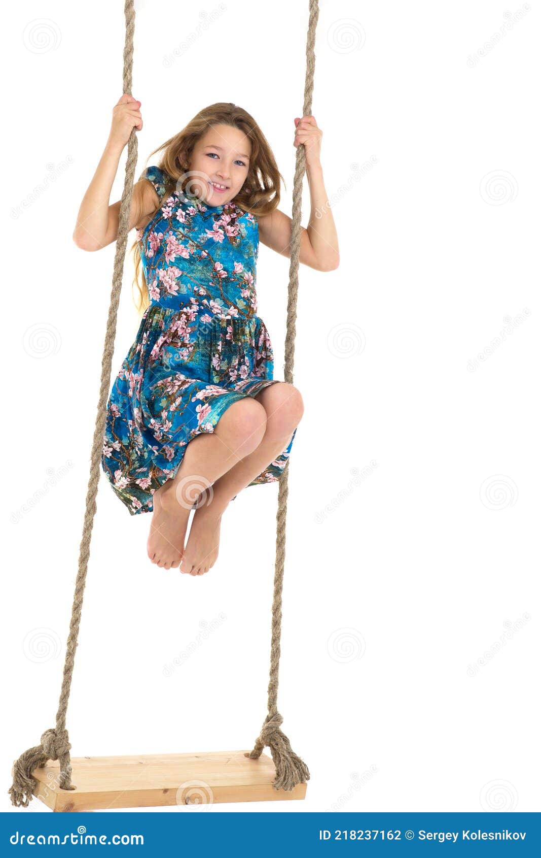 Girl Standing on Rope Swing.Portrait of Happy Preteen Child Stock Photo ...