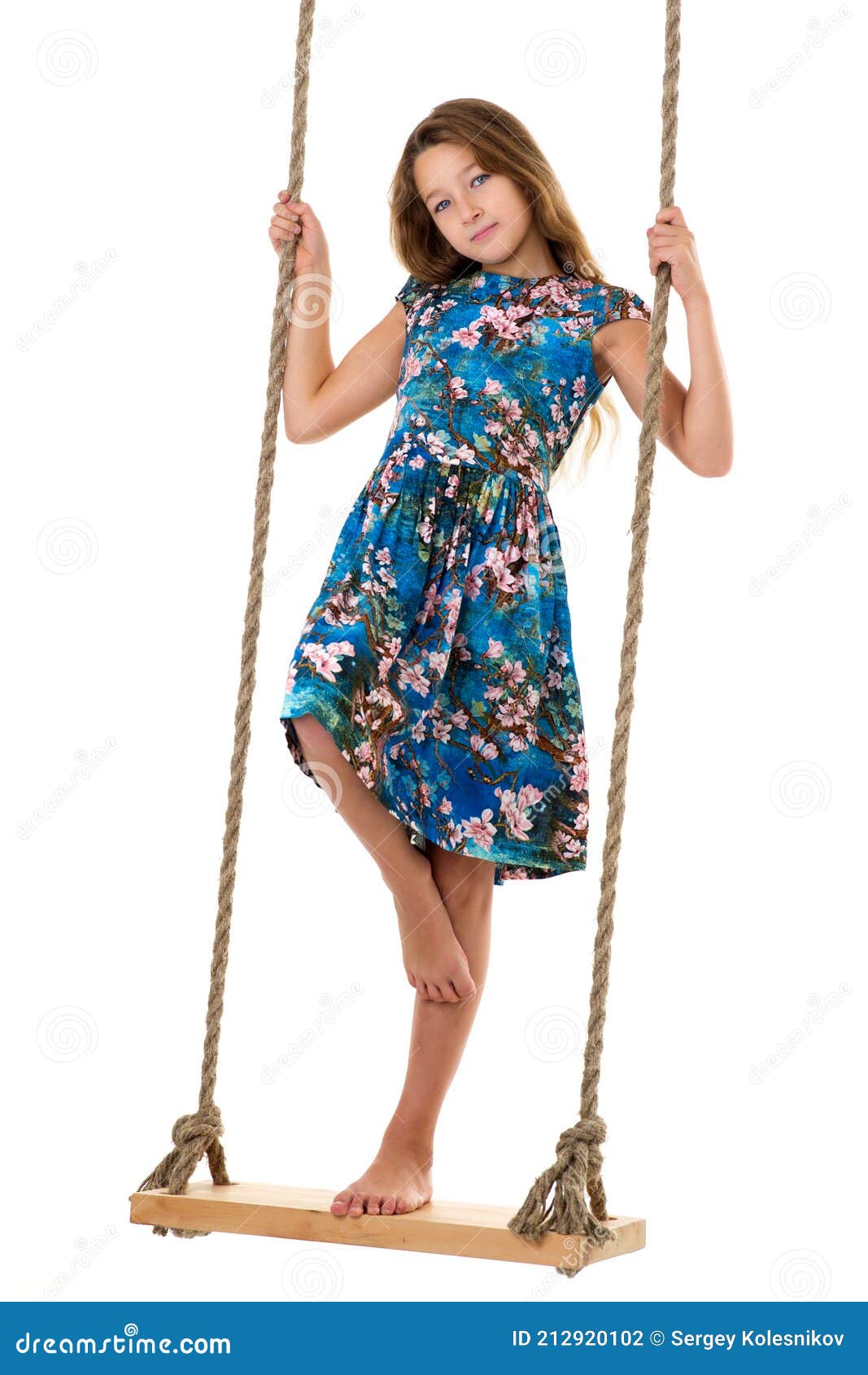 Girl Standing on Rope Swing.Portrait of Happy Preteen Child Stock Photo ...