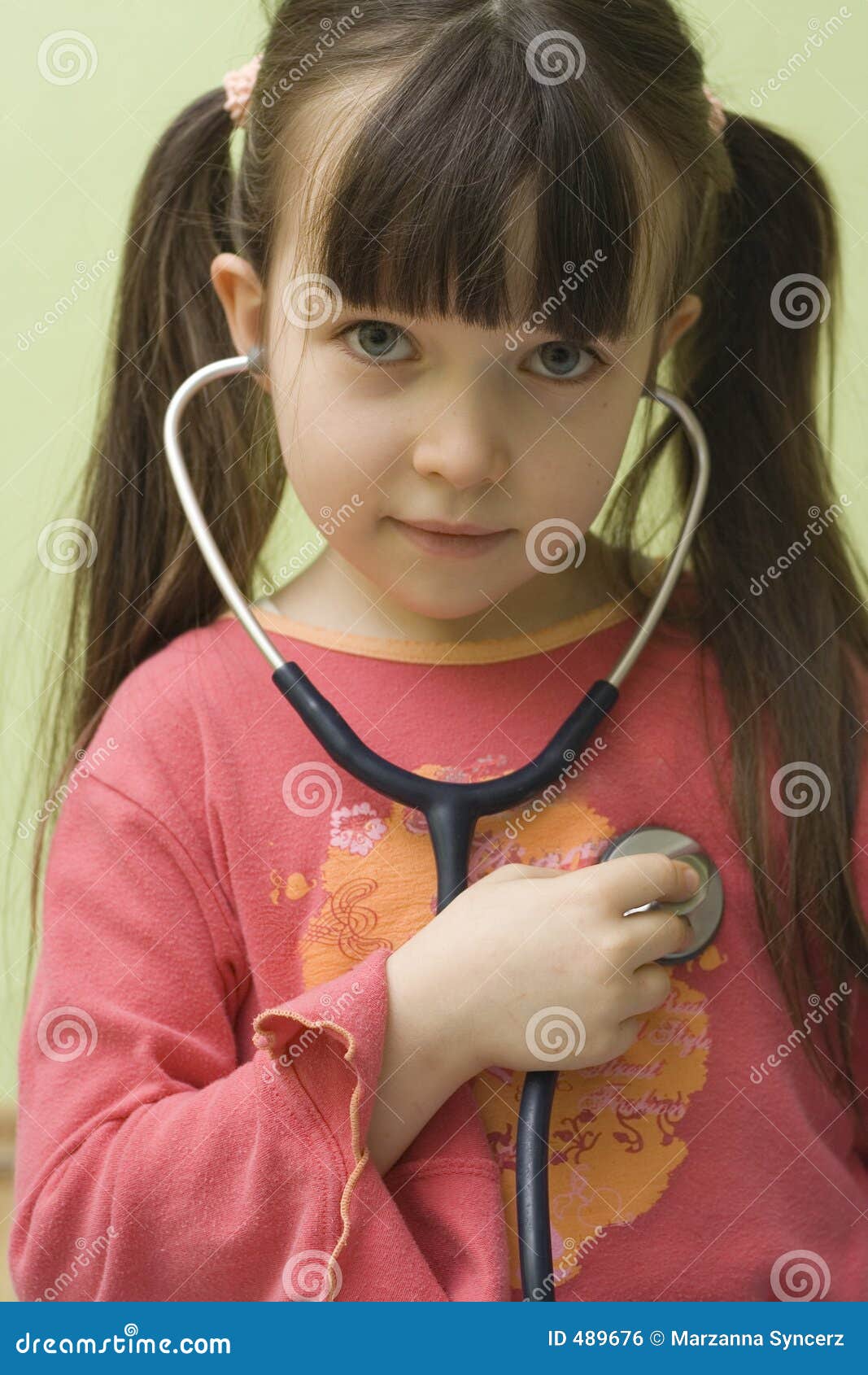 Girl with stethoscope stock photo. Image of play, stethoscope 489676