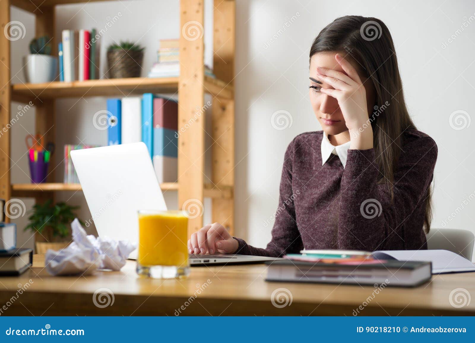 She study for her exams. Sad woman read Letter.