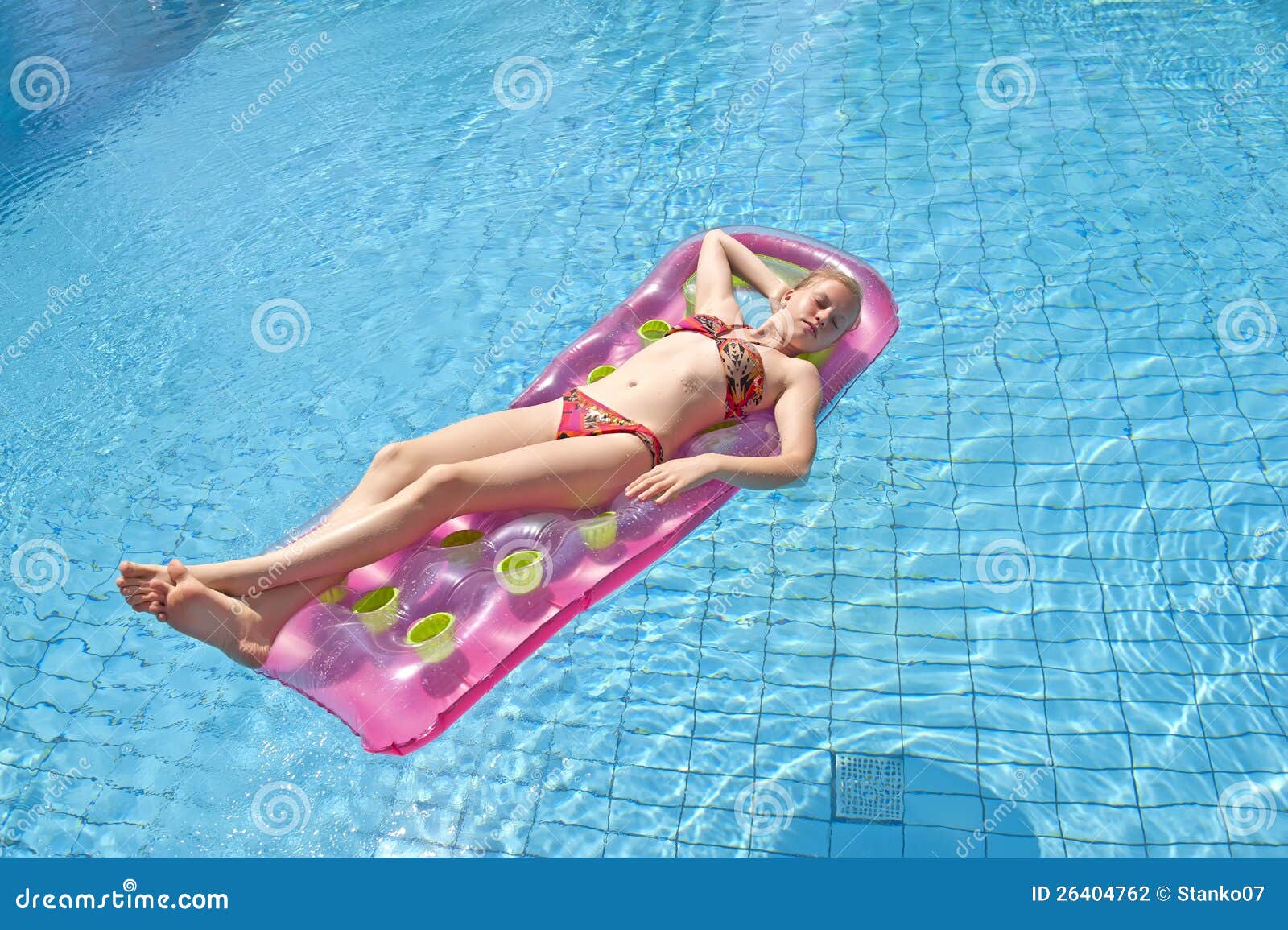 girl sunbathing on a mattress