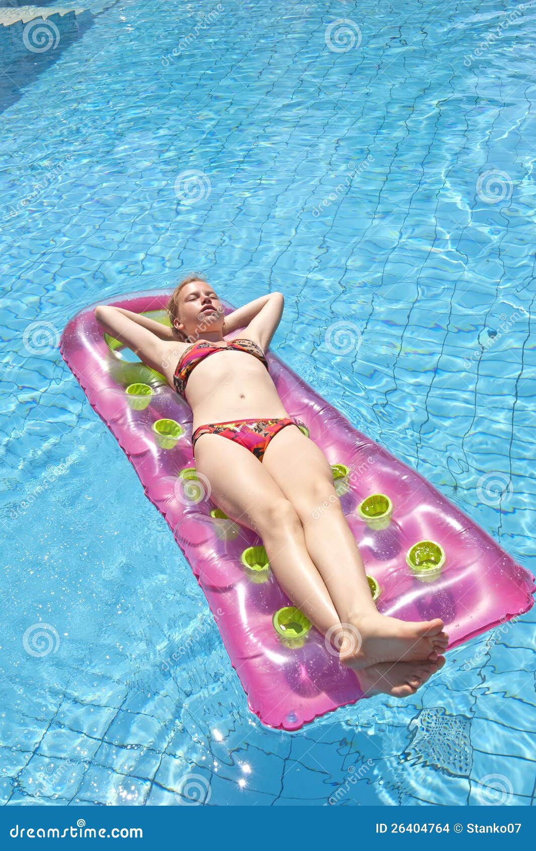 girl sunbathing on a mattress