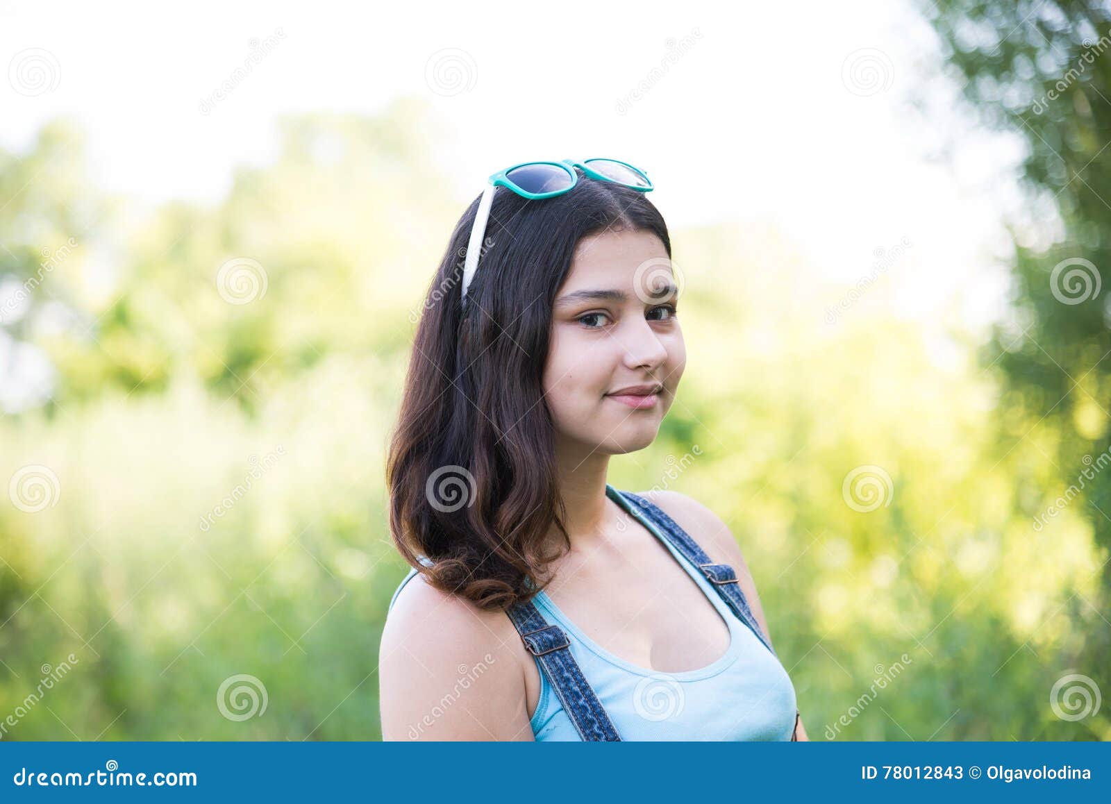 Girl with Sunglasses on Her Head Posing in Nature Stock Image Image
