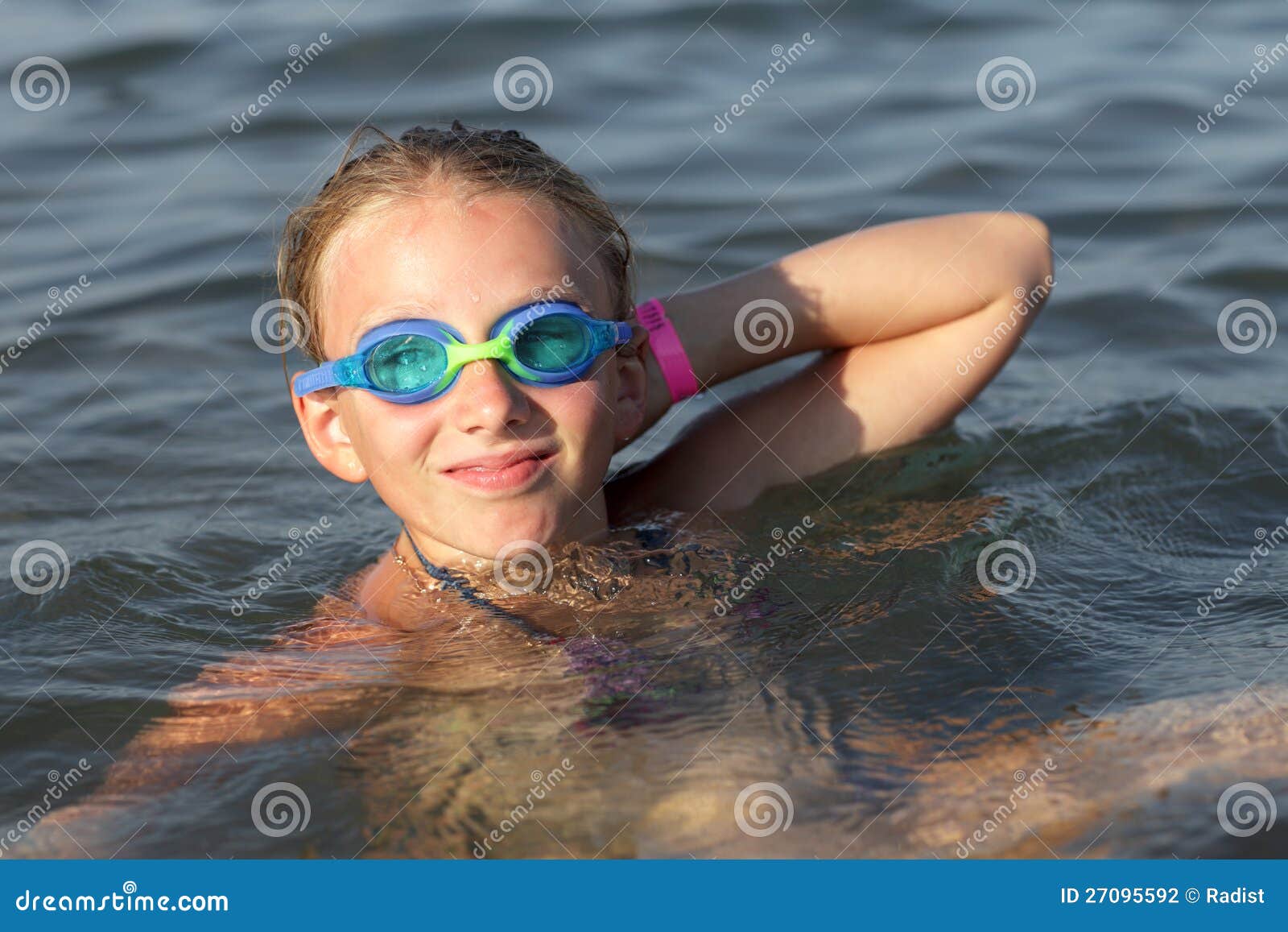 Girl in swimming glasses stock photo. Image of smiling 27095592