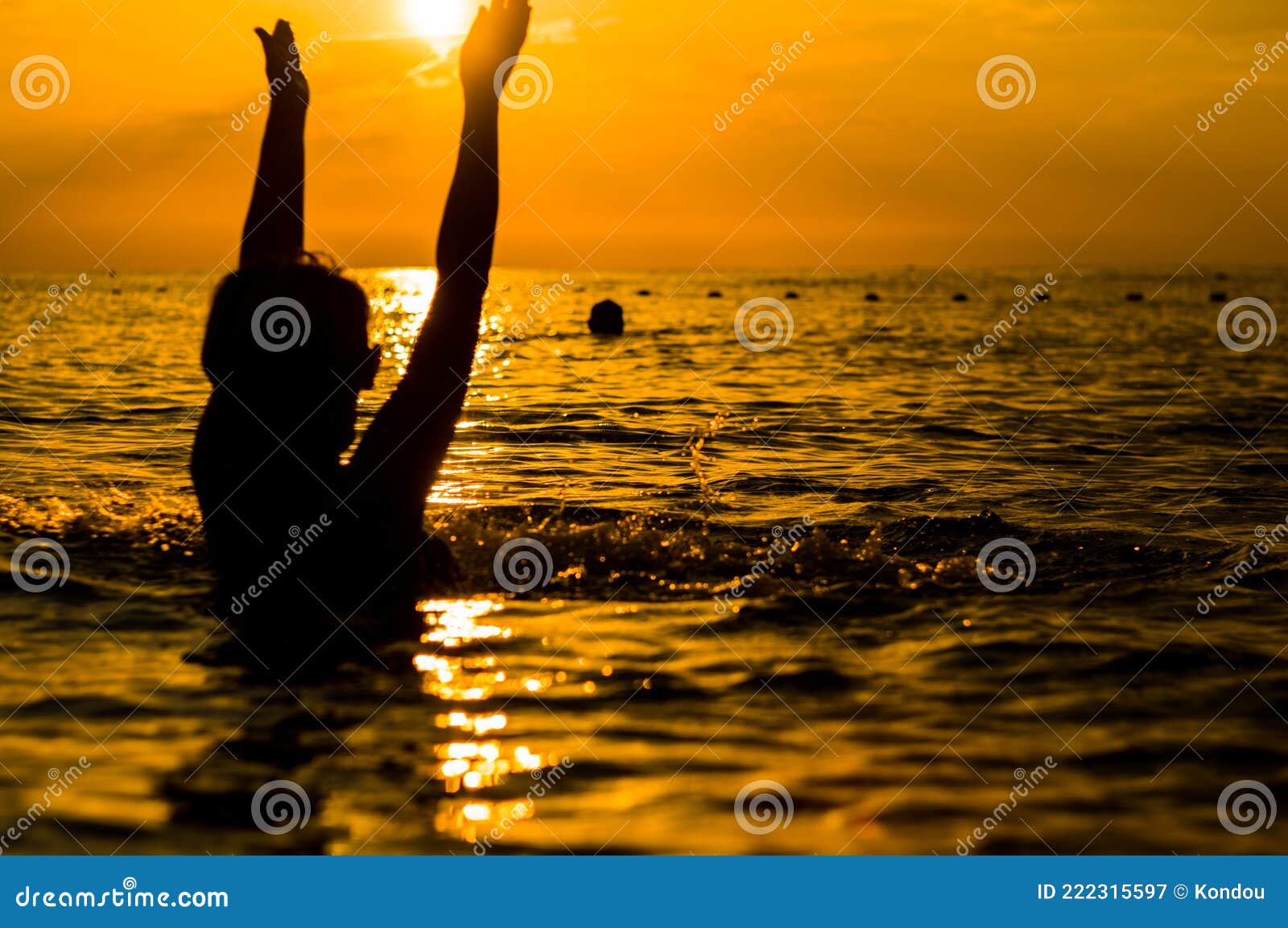 Girl Swimming in the Sea at Sunset, Splashes of Transparency Water ...