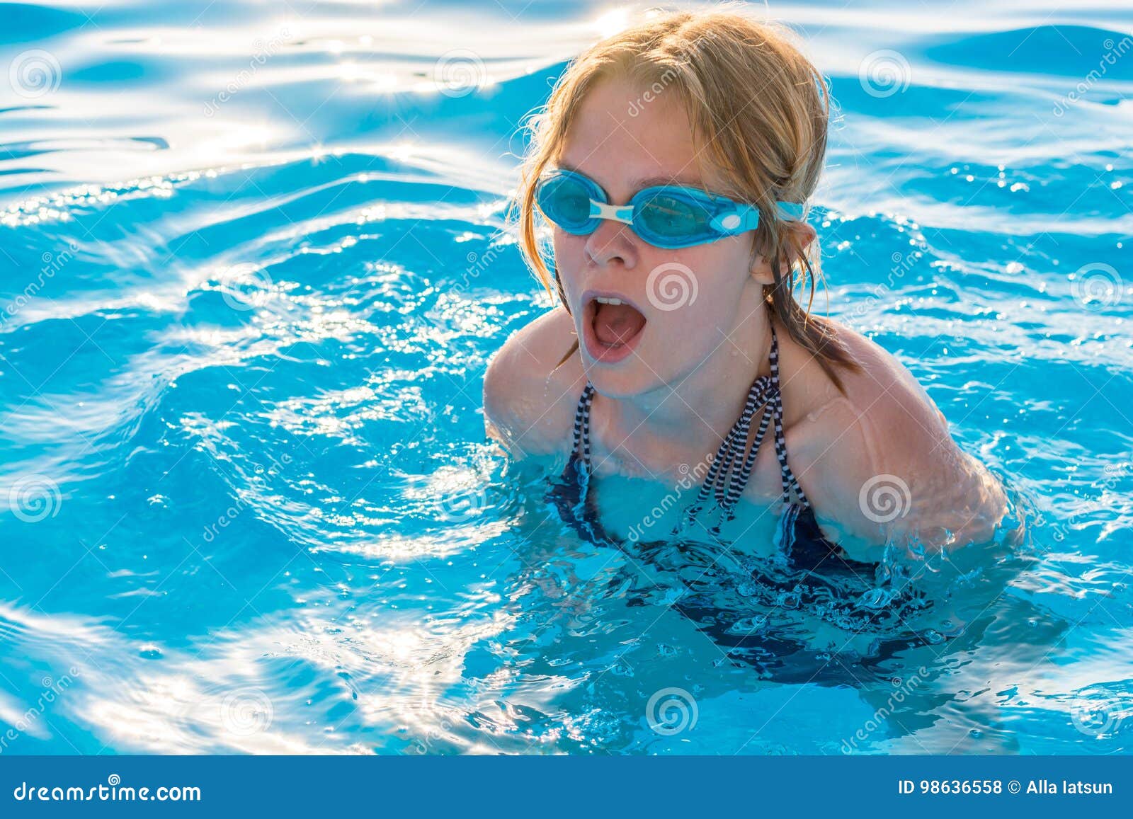 Girl Swims in the Pool with Glasses for Swimming Stock Photo Image of