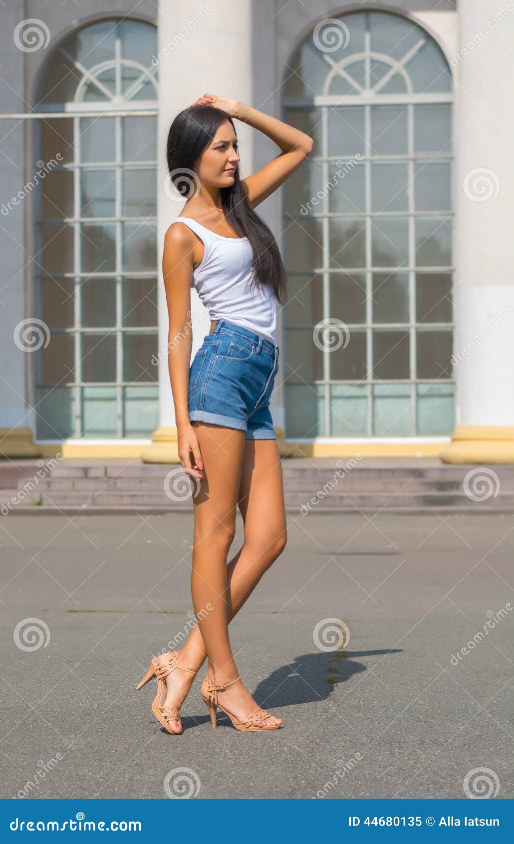 Girl In A T-shirt And Shorts In Front Of A Building With Columns Stock
Image - Image of building
