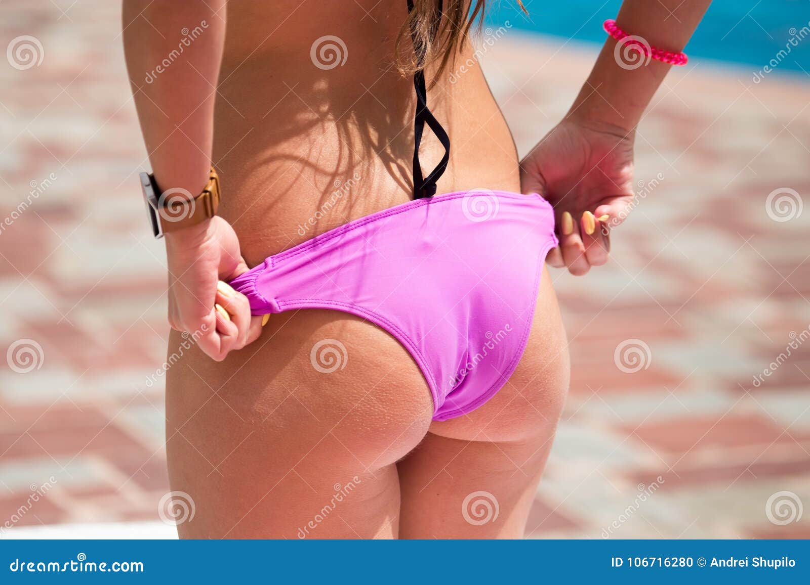 The Girl Takes Off Her Pants on the Beach Stock Photo Image of