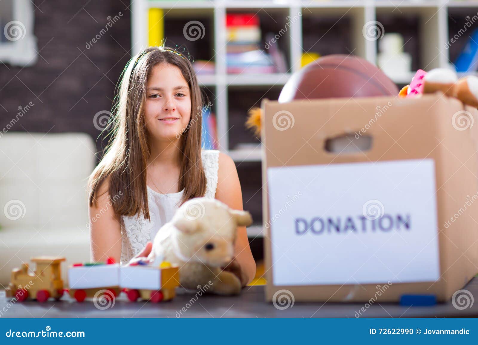 Girl Taking Donation Box Full with Stuff for Donate Stock Photo Image