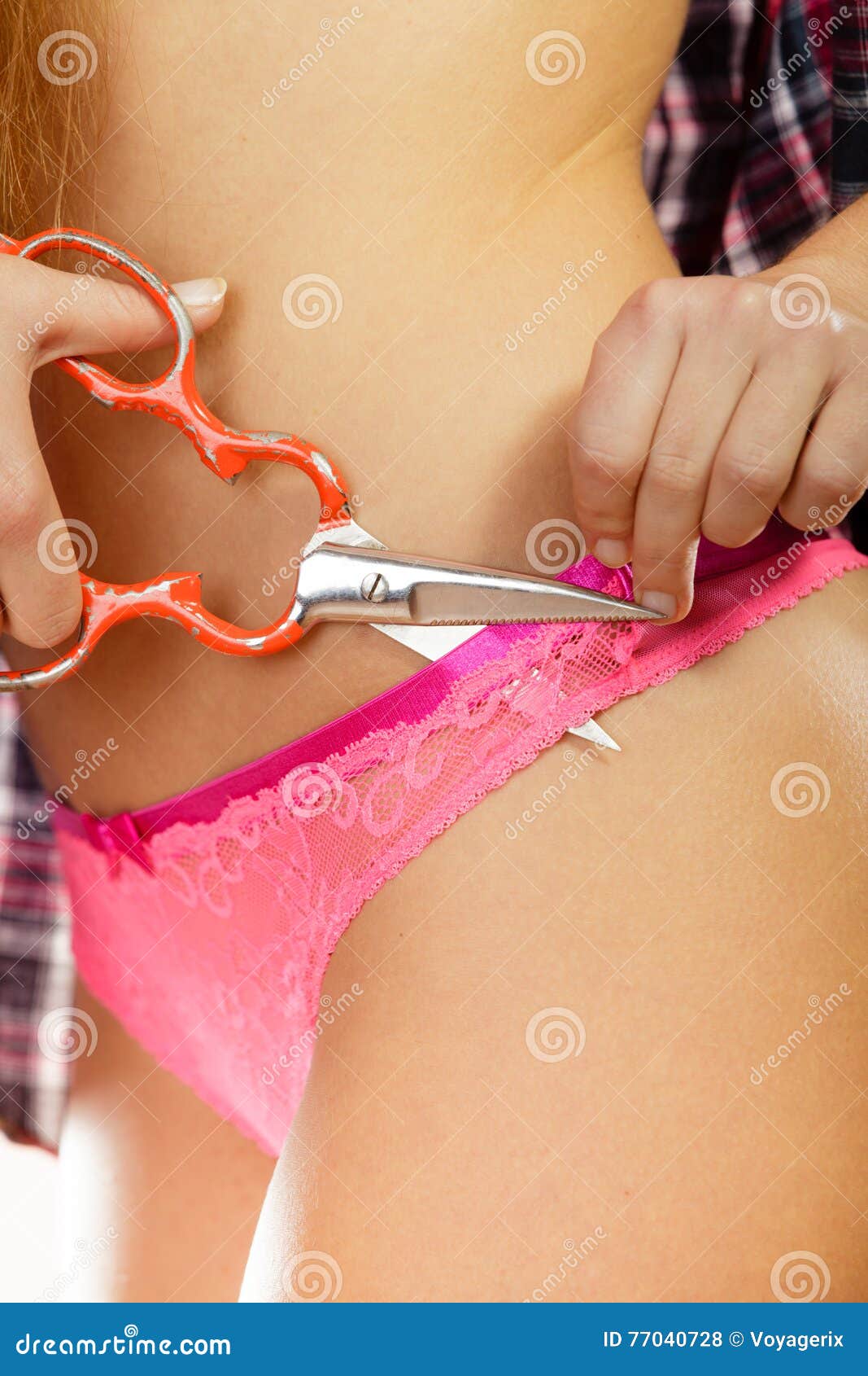 Girl Taking Off Panties, Cutting Her Lingerie with Scissors Stock