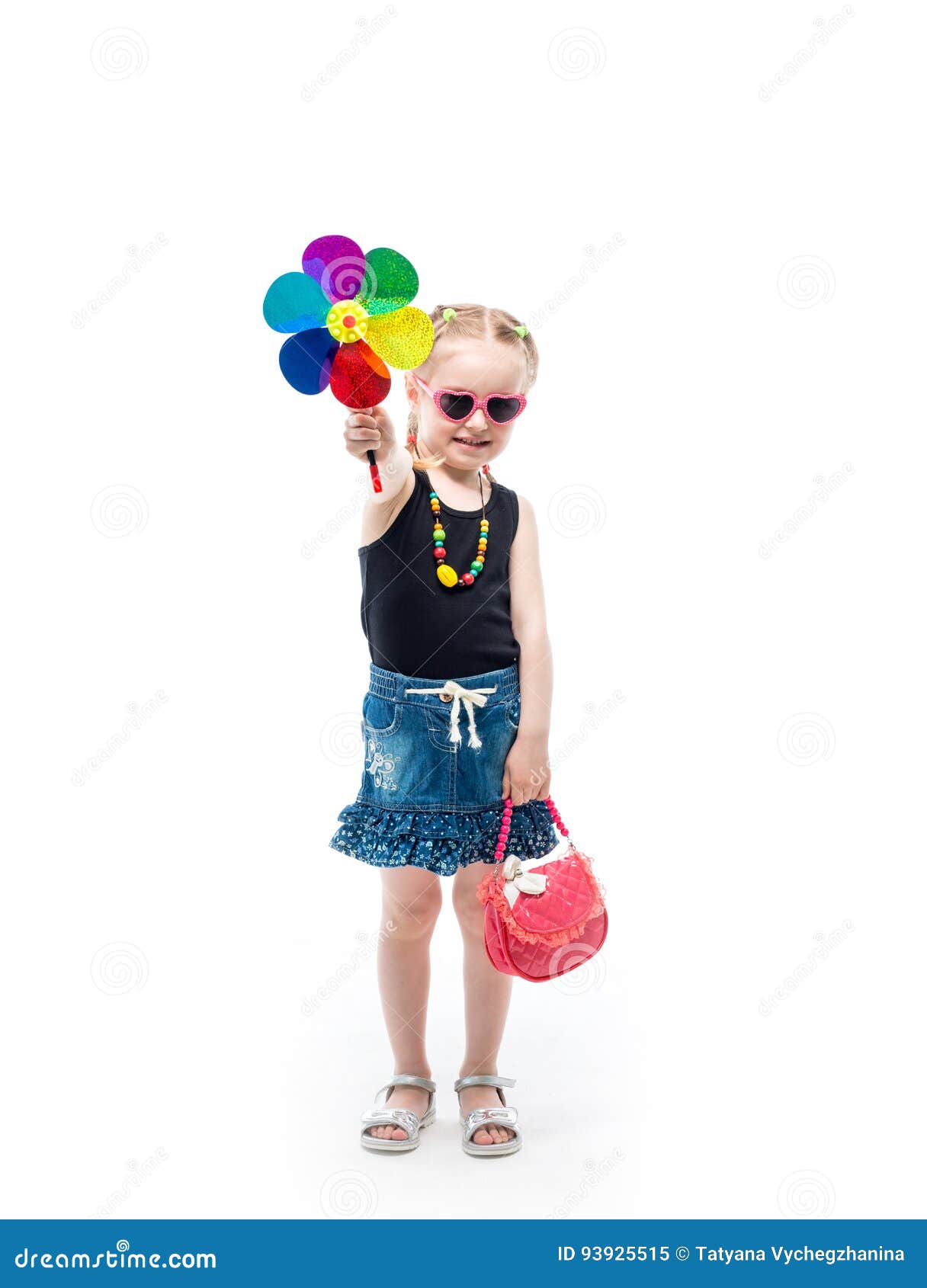 girl in tanktop and skirt with a toy