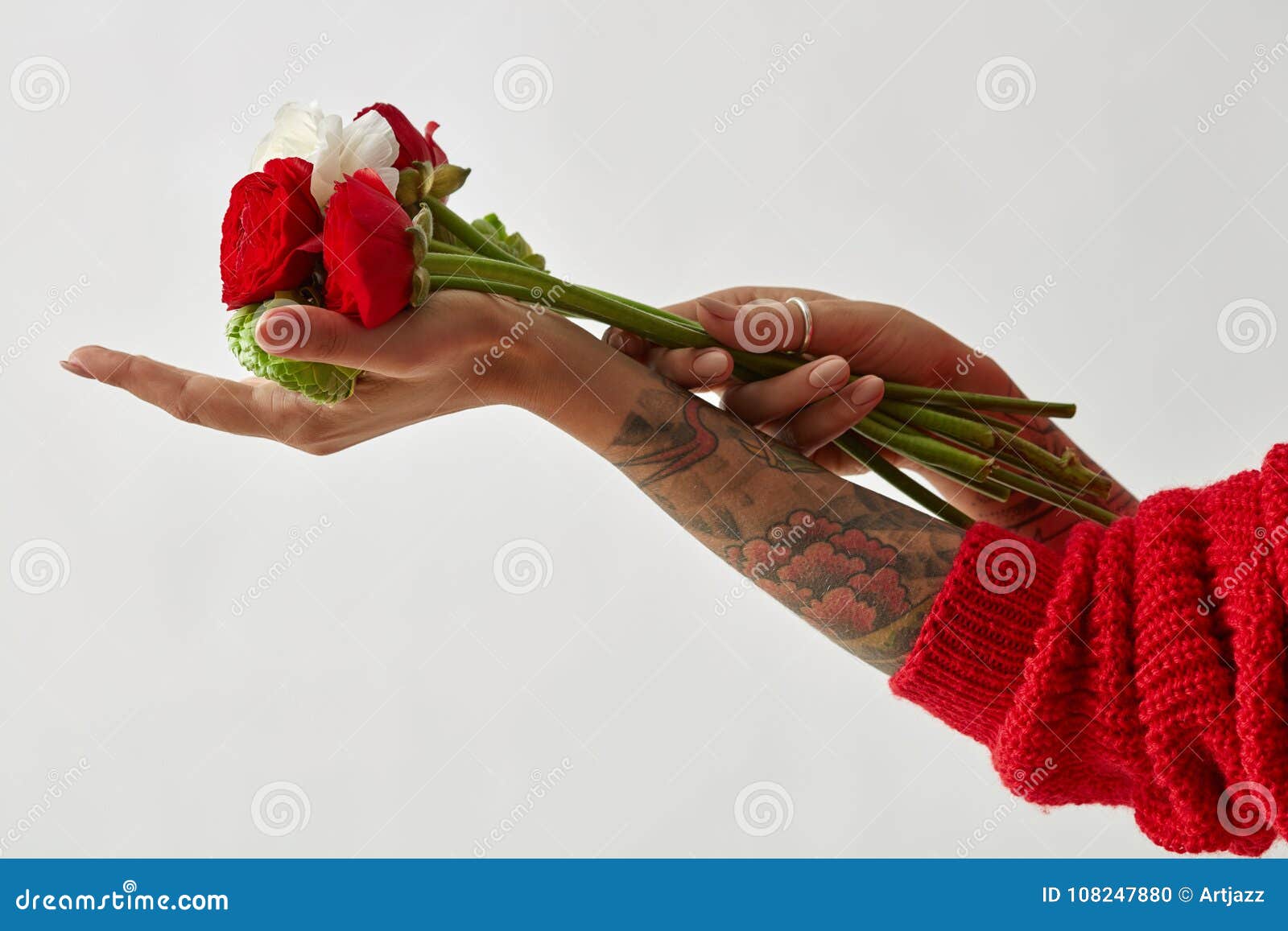 girl with a tattoo on her hands holding a bouquet of flowers stock photo   artjazz 8816592  Stockfresh