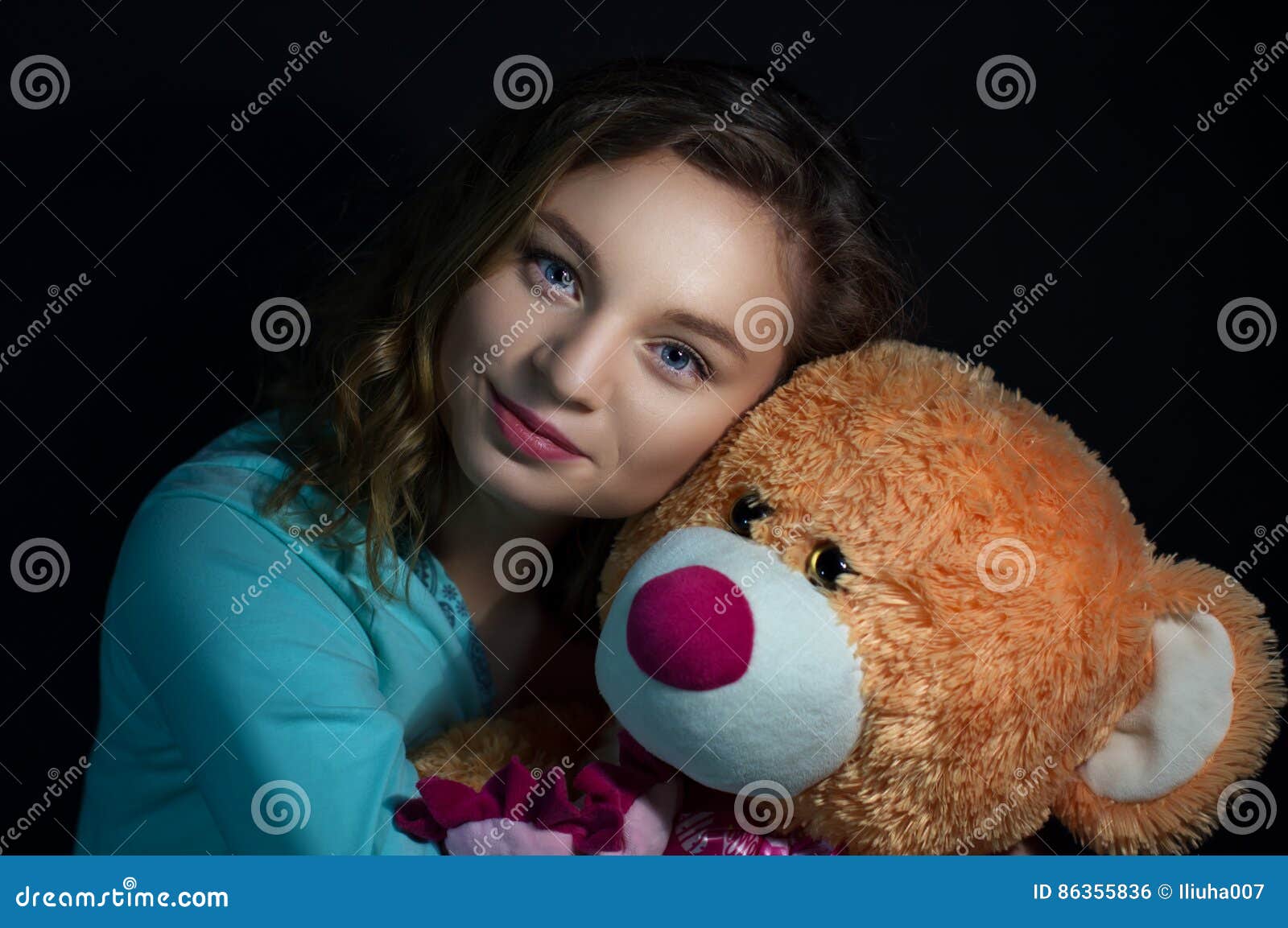 Girl with a Teddy Bear on a Dark Background Stock Photo - Image of ...