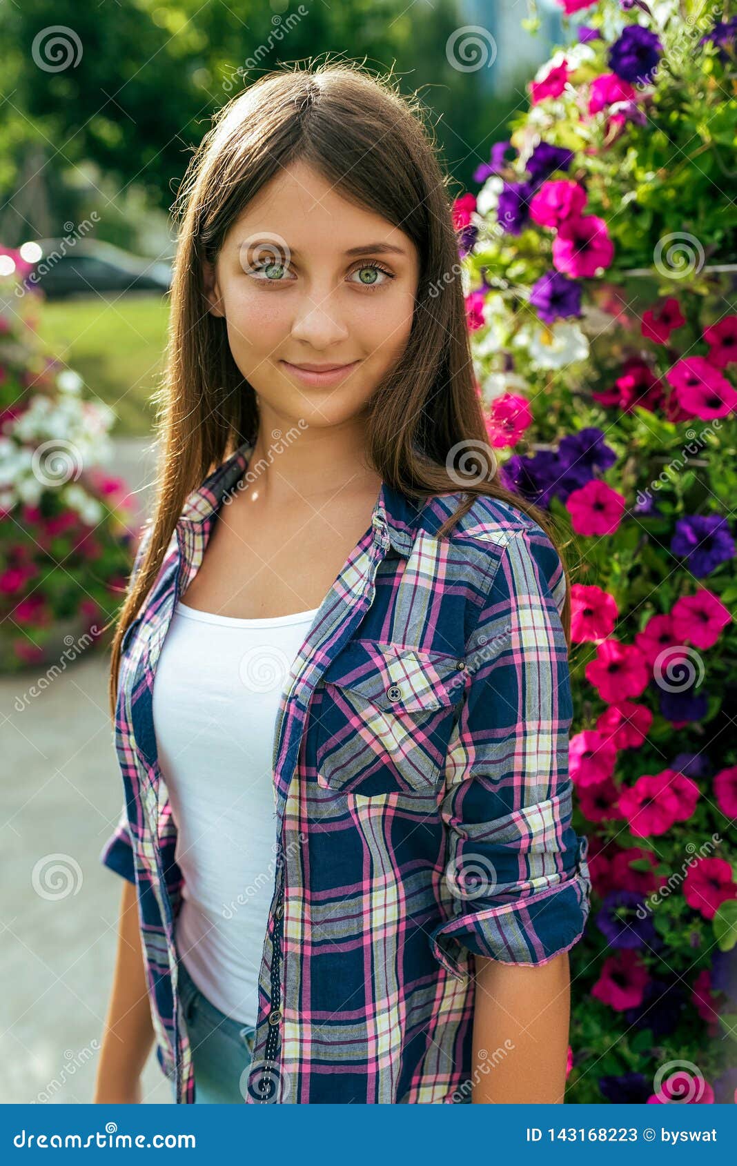 Girl Teenager Beautiful 11 14 Years On The Background Of A Flower Bed Happy Smiles In The Summer In City After School Stock Image Image Of Person Natural