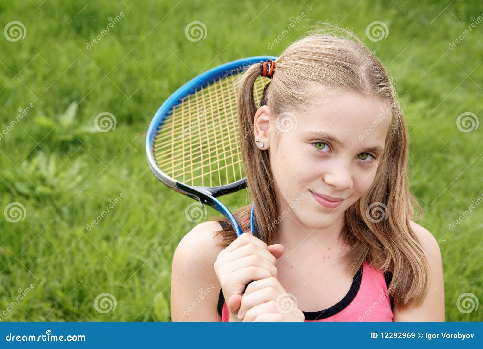 Happy Teenage Girl In Sport Outfits Holding Tennis Racket 