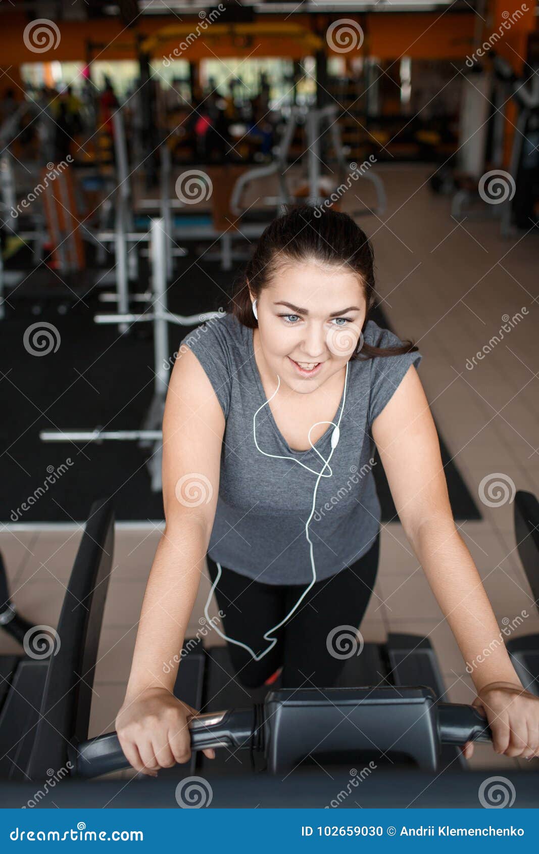 A Girl Trains on a Running Simulator in the Gym. Stock Photo - Image of ...