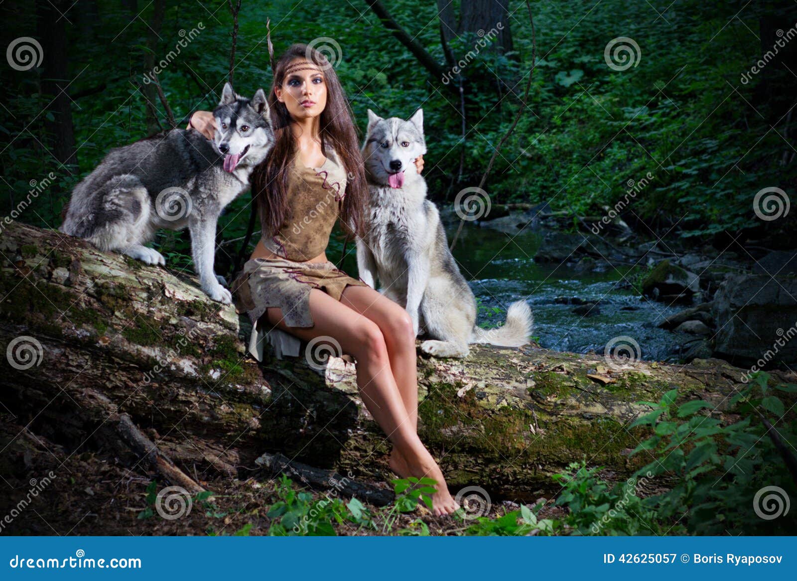 Young girl with two dogs at forest