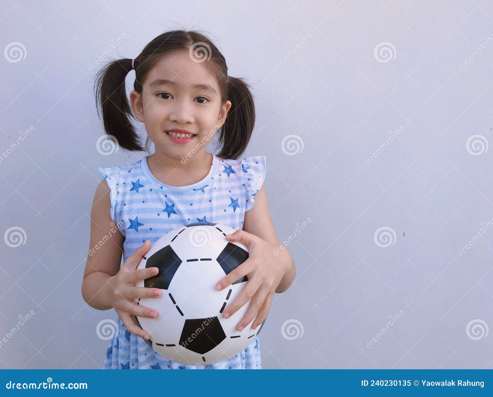 The girl playing football stock image. Image of outfit - 240230135