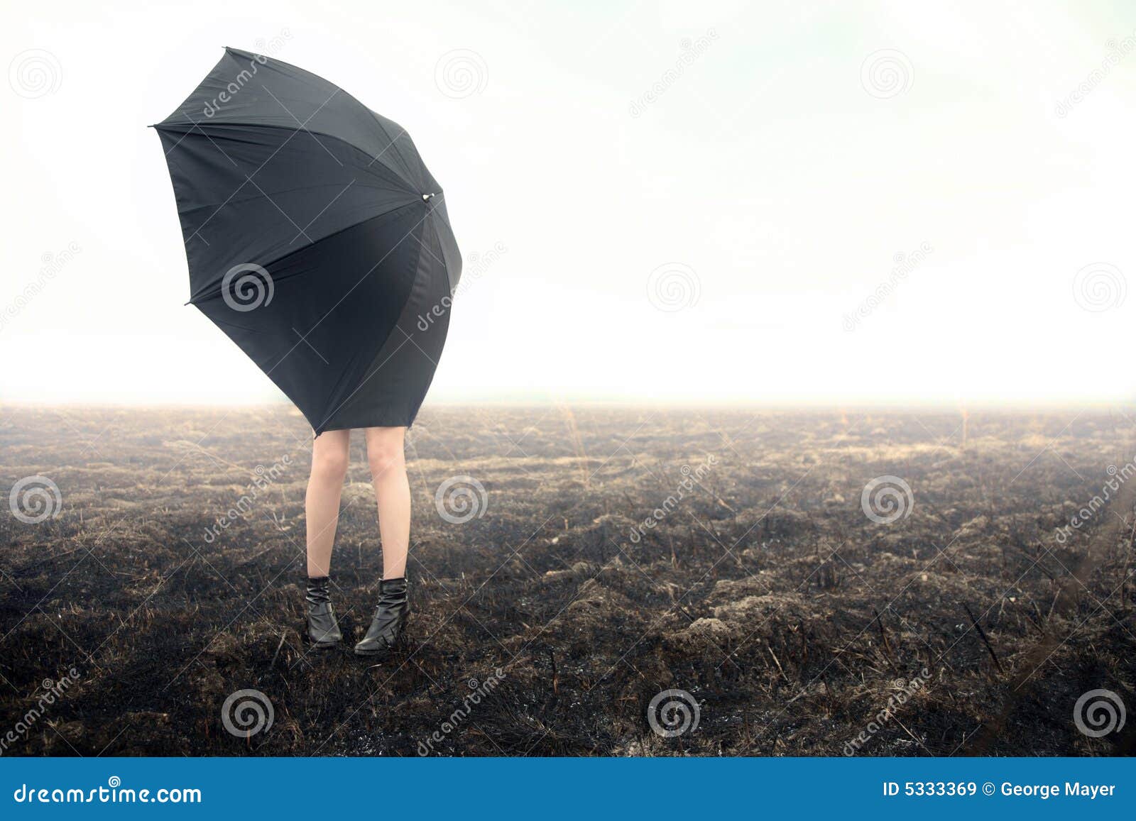 girl with umbrella on black field
