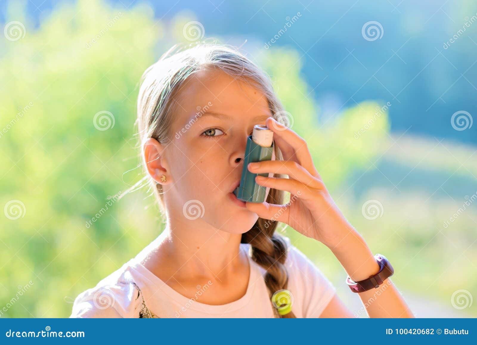 Girl using asthma inhaler stock photo. Image of nature 100420682