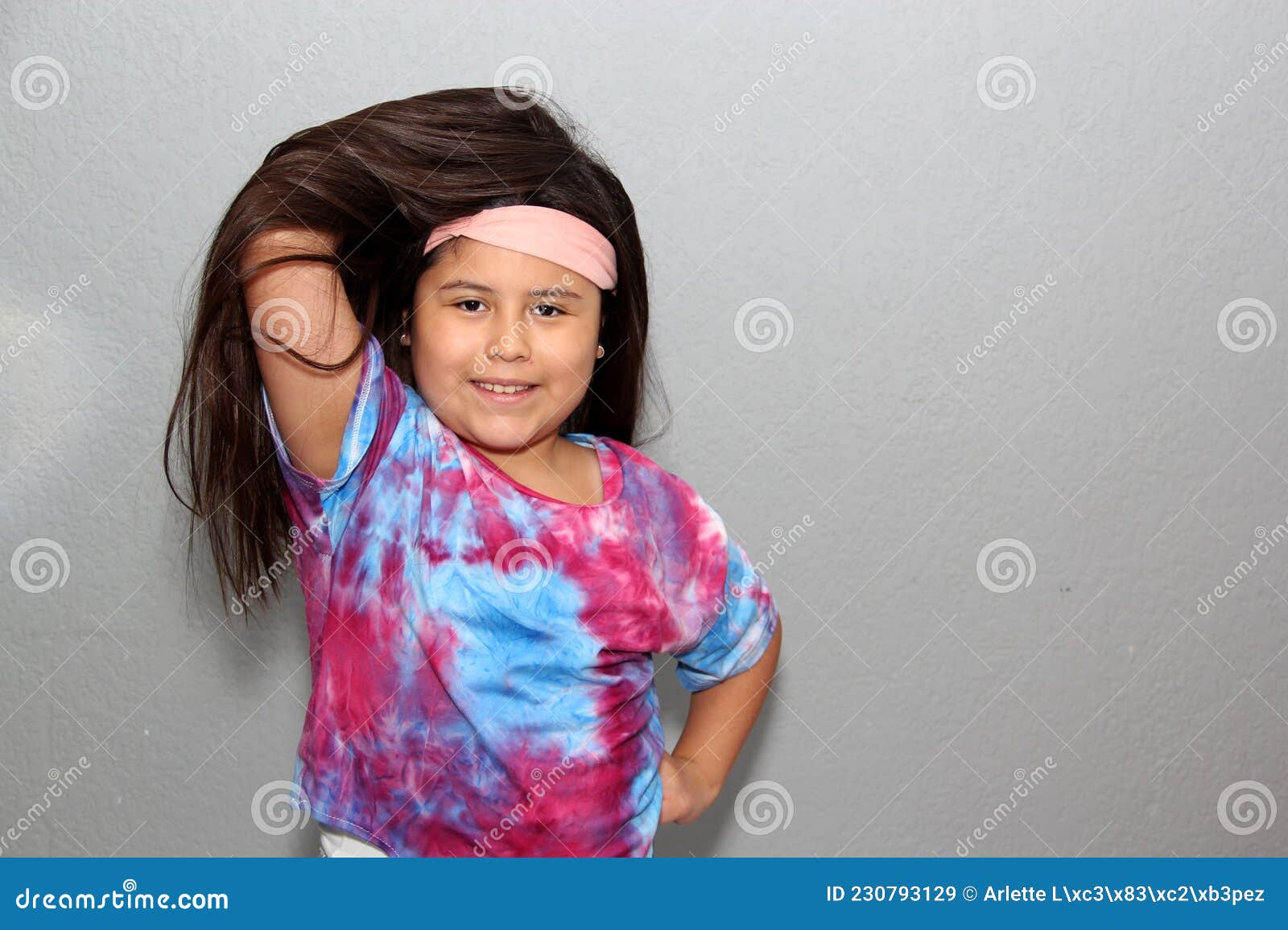 10 Year Old Hispanic Girl with Very Long Black Straight Hair Modeling  Happily for the Camera in a Tie Dye Style Shirt Stock Image - Image of  cute, people: 230793129