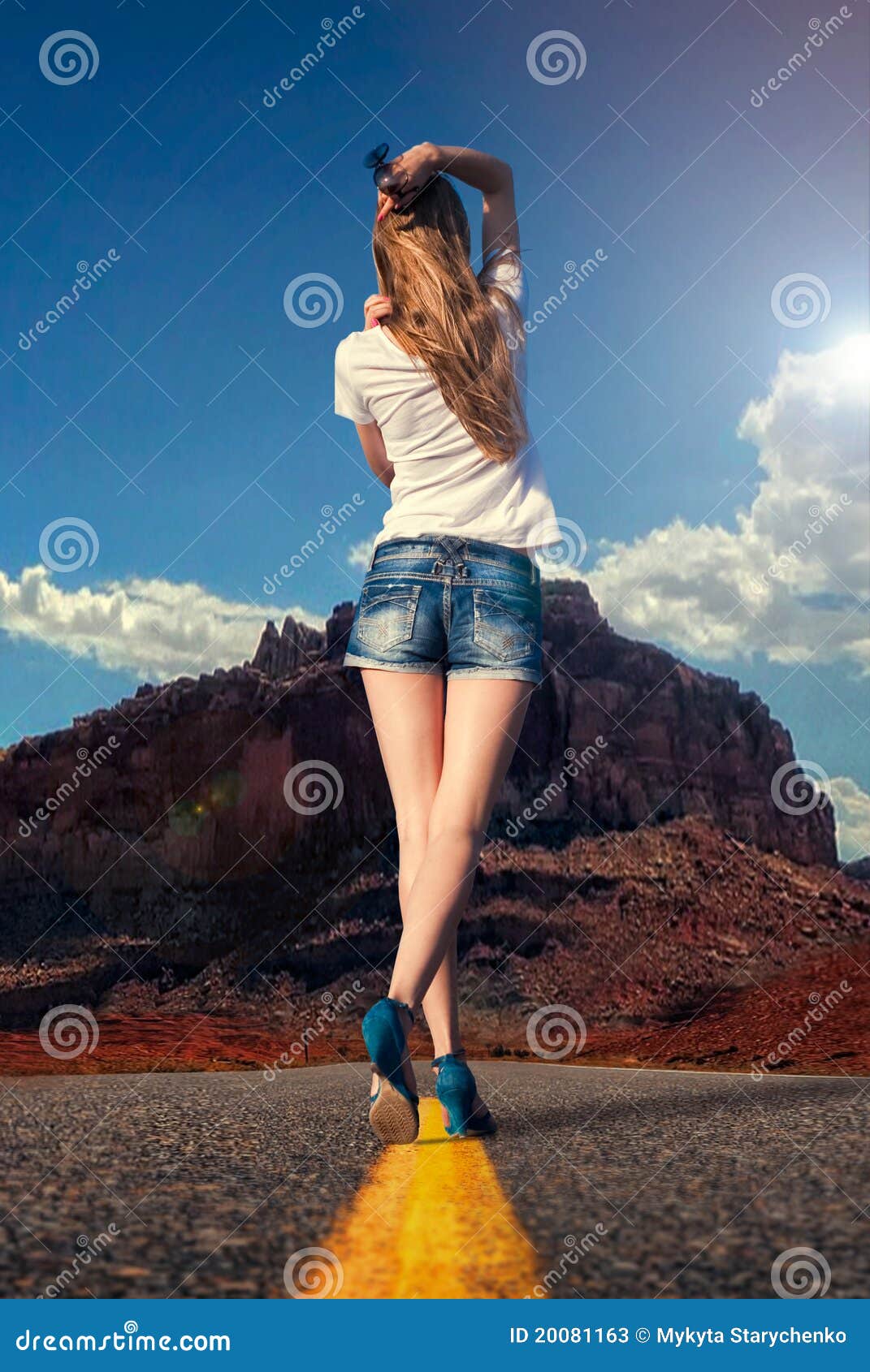 girl walking along the road in the desert